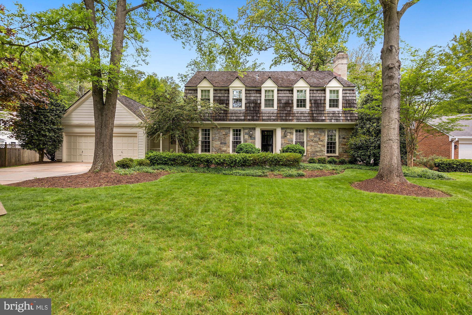 Simply stunning, meticulously renovated throughout with only the best materials and top quality craftsmanship...you will love this charming, Gosnell stone front, "Windsor" colonial with one of the most amazing, private, level backyards in River Falls. It looks like an English park! Enjoy your morning coffee on the Trex deck w/the custom Chippendale railing admiring the gorgeous view. Inside, beautiful renovations include a new kitchen (2019) with Custom Shaker-style cabinetry, Taj Mahal quartzite countertops, professional grade appliances including a Wolf 6 burner gas (propane) cooktop and large stainless steel double wall ovens. Newer Primary Bathroom with white Carrera marble, soaking tub, stall shower, Water Works fixtures. Fully renovated Secondary upper baths including Ivory Travertine, custom cabinetry, Water Works fixtures. Exceptional, large floor plan including main level, private, home office with built-in cabinetry and shelving plus a spacious, comfy Family Room with a wood burning fireplace, painted brick hearth and a wall of built-ins, access to rear deck. Custom trim including thick crown molding and keystones, recessed lighting throughout all three levels, replacement Pella double pane, tru-divide windows. One of the finest offerings you will see this year! Come make it yours to treasure for years to come!
