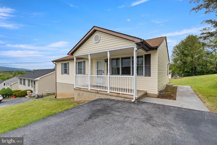 Well-kept rancher with full basement situated on a nice in-town lot with beautiful mountain views! This home offers 2 bedrooms on the main level with a possible 3rd bedroom in the basement, along with 1.5 baths. Covered front porch faces Signal Knob and is the perfect spot to relax and enjoy the scenery. A full  partially finished basement could provide additional living space, storage, or hobby area possibilities. Newer roof already in place and the home has been well maintained over the years. Convenient in-town location with a nice yard and plenty of potential!