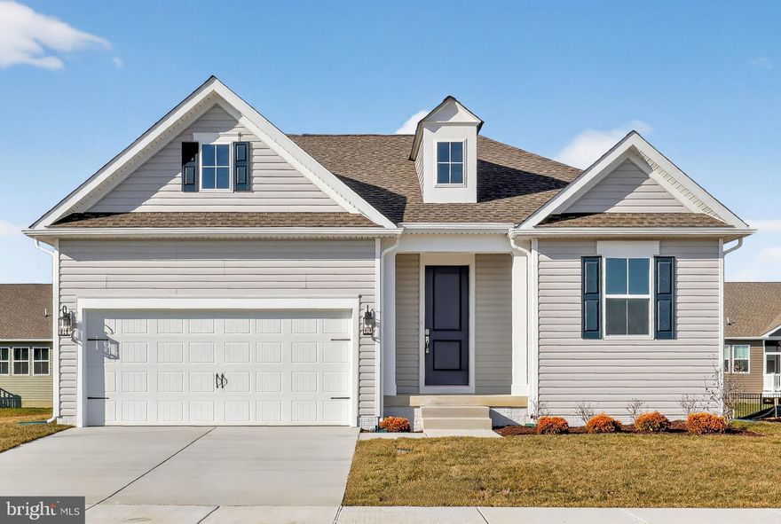 The Daffodil V home combines an open floor plan with the classic design elements that balance style and function. With 3 bedrooms, 2 baths, and a 2-car garage, this home offers thoughtfully designed spaces perfect for both everyday living and entertaining.

Highlights include trimmed feature walls in both the foyer and owner’s suite, a cozy fireplace, and a screened deck that extends your living space outdoors. A dedicated Home Technology Suite adds modern convenience, making this home as functional as it is beautiful.

The kitchen features upgraded stainless steel appliances and sleek Steel Gray granite countertops. Durable luxury vinyl plank flooring runs through the foyer, kitchen, dining, and great room, while the baths are designed with quartz countertops and a walk-in shower for a spa-like retreat.

For a full list of included features, please contact our sales representatives.
Photos are for illustrative purposes only and may not represent the exact home or finishes available.

Welcome to a new active adult 55+ community in Magnolia, DE, offering low-maintenance, resort-style living with beautiful single-family new homes. Enjoy amenities including a luxurious clubhouse, pickleball courts, and a pool with cabanas and tiki bar. Here you can enjoy the company of people who have worked hard and now want to enjoy all that a luxury community has to offer. The low-maintenance lifestyle assures that your lawn care is out of your hands, keeping you free to spend time with friends at the clubhouse or at the nearby beaches. Just minutes from Route 1 in Delaware with tax-free shopping, dining and entertainment, this 55+ active adult community offers everyday convenience together with the serenity of a picturesque Delaware landscape. The relationships that you make and the people you spend time with here will create memories for years to come.