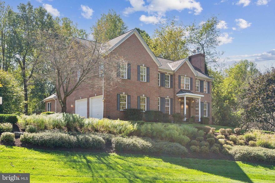 Absolutely stunning all brick colonial perfectly tucked away in the sought after community of Cranberry Woods!!  Where do we even begin with this gorgeous home?!?  You will immediately be impressed and feel at home as soon as you walk in the front door.  Freshly refinished hardwood floors lead through an open and inviting main level that is absolutely perfect for gathering, entertaining or just relaxing. Updated features of note are new quartz countertops and updated hardware in the kitchen, all SS appliances with bonus drink fridge AND wine fridge, TWO pantries (one walk in), geniusly converted dining room into bar/sitting area, dining area with gas fireplace and updated powder room with shiplap.  As you make your way to the rear of the home you will find your soon to be favorite room, the skylit sunroom, which shares a two sided stone fireplace with the family room featuring a wonderfully executed accent wall.  All of this flows seamlessly to the oversized deck with an outside TV combined with a stunningly peaceful wooded private vista. Also sure to impress is the professionally installed custom sport court!! Don't miss the garage as it is not your normal garage, epoxy floors, built in storage and completely finished to include recessed lighting. Whew, we haven't even made it off the main level yet!!  Upstairs features 5 bedrooms including a primary retreat with huge walk in closet and huge primary bathroom with a jacuzzi tub and oversized shower. One of the bedrooms connects with the primary making it perfect for a nursery, craft room, second office, reading room, etc. Also very conveniently located upstairs is a dedicated laundry room.  One of the secondary bedrooms has an ensuite bathroom and the others share a hall bathroom.  You will continue to be impressed as you make your way to the basement!  Huge open rec area and secondary family room allows you to utilize the space however you would like.  At this point you will begin to get a peak at another one of the homes "wow factors" which is a custom built in home gym which adjoins an in home work shop!!  Fear not though, because there is still tons of storage in the remainder of the basement.  Please don't hesitate in coming to see this stunning home - homes like this don't come on the market often!!