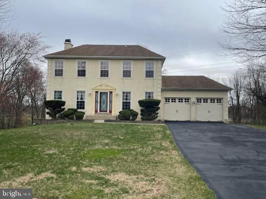 Beautiful, stucco colonial located in a cul-de-sac in the Woods of Neshaminy.  Featuring 4 bedrooms and 3 and ½ half bathrooms.  Master bedroom has updated bathroom with Roman tub, shower stall and walk in closet.  Second floor has oak hardwood flooring in all the bedrooms.  First floor has Brazilian cherry hardwood flooring in the family room, dining room and living room.  Dining room features crown molding and chair rail molding.  Living room has a wood burning fireplace.  Eat in kitchen with cherry cabinetry, island countertop, granite counters, ceramic tile backsplash and flooring.  Kitchen sliding glass door leading to the Trex deck with steps leading down to the stamped concrete patio.  Finished, walkout basement with ceramic tile flooring, full bathroom, laundry area and sliding door exiting to the back yard.  Automatic lighting in the large yard that has a park like setting which backs up to the stream and woods.  House has attached 2 car garage and driveway which can park additional 4 cars.  House provides plenty of sunlight in every room and it is in move in condition.