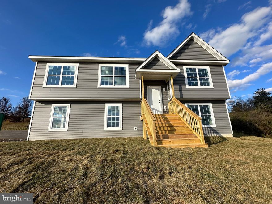 Turn-key ready! -This new construction home is surrounded by beautiful MOUNTAIN VIEWS..sitting on over  a half of acre in the desirable "Waterview Estates" . This split foyer features 3 bedrooms 2.5 Bathrooms, a partially finished basement, with a two car garage. Upon entering the home head upstairs to the open concept layout. The living room features lvp flooring and vaulted ceilings, off the dining room is a sliding glass door which brings in lots of natural light, and the kitchen features stainless steel appliances with plenty of counter-top space. Luxury vinyl plank flooring through out the main level of home, with bedrooms having carpet. Floor plan also features the popular split bedroom floor plan. Primary bedroom has tray ceilings, walk-in closet, and a primary bathroom with bath. Downstairs you will find the two car garage and partially finished basement. 1/2 bathoom, laundry room, and a huge recreation room.