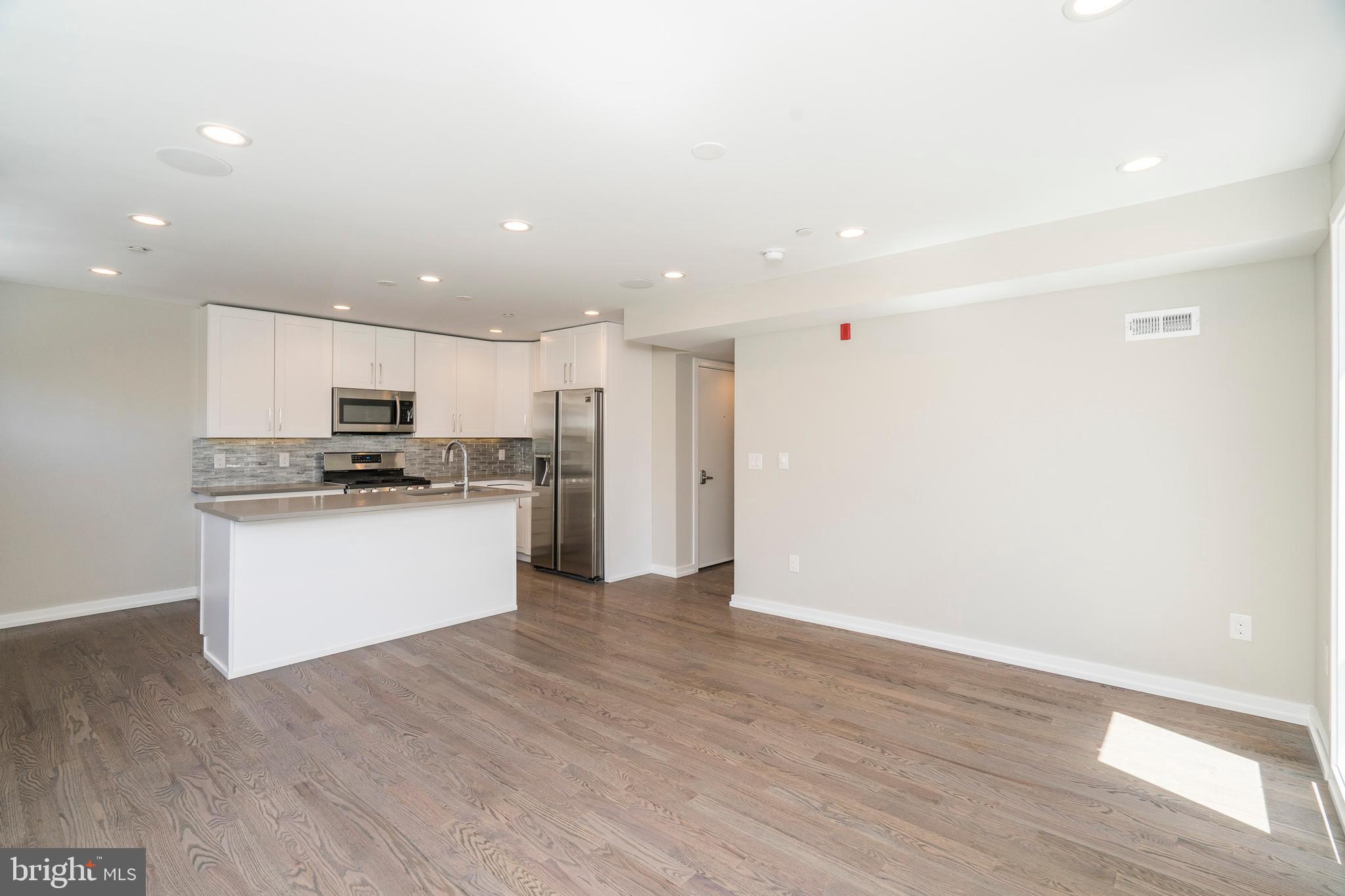 This beautiful unit offers luxurious space at a great value. Upon entering immediately notice the great natural light from the large windows. Step across the fine hardwood flooring to your modern kitchen, featuring all brand new Samsung appliances, quartz countertops with bar seating, and ample cabinet space. NEST Thermostats, hard-wired speakers in the ceiling, and Video Intercom to the front entrance are just some of the many features of this condo. This unit features three bedrooms with hardwood flooring, large closets and recessed lighting, and two full bathrooms that offer fantastic tile, a tub, shower, and vanity. Prime Location! This property provides easy access to restaurants, shopping, schools, public transportation and much more. Easily walk to the Center City, the Broad Street Subway, Rittenhouse Square, and the Schuylkill River Trail. Great access to Penn, Drexel, and CHOP. Close to I-76 and I-95 for an easy commute out of the city. Located in the Greenfield Catchment. Don't miss a great opportunity to live in this one of a kind building.