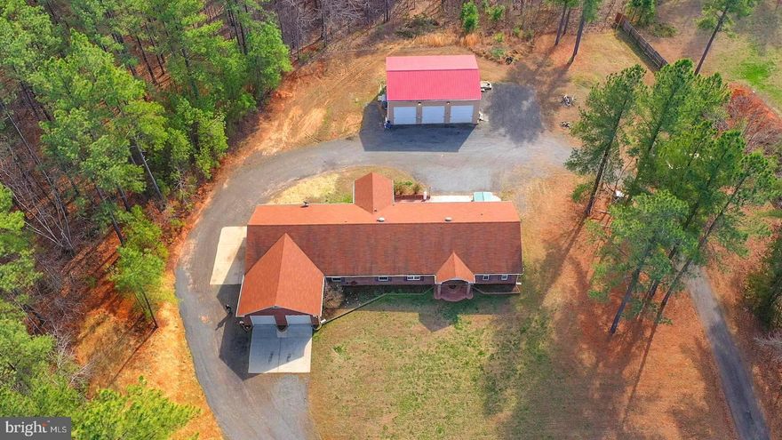Rarely does a home with this many features become available. Ready to move in “one of a kind” all brick rancher with a split bedroom floor plan nestled on just under 3 beautiful acres in the heart of Locust Grove, Virginia, offers 4 spacious bedroom, 3 full baths, a ¾ bath, an attached 5 car garage, plus a large laundry utility / mud room. This secluded private property boasts a detached 30’ x 40’ (3) bay garage/workshop set up with a BenPak 2 post 10,000 lb electric lift and a compact floor mounted metal bender. HIGH SPEED FIBER OPTIC INTERNET and NO HOA. Once inside you’ll immediately notice the fresh paint, brand new carpet, luxury vinyl flooring, as well as updated lighting, and newer appliances. In the great room there is a showcase gas fireplace which is perfect to enjoy on those cool Virginia evenings. The owner's suite comes complete with 2 full walk-in closets, separate tiled shower enclosure, jetted Jacuzzi tub, separate vanities, and a bidet. The generous rear brick patio is perfect for entertaining and offers a large 5 person HotSpring hot tub. The true Shining Star is the 30’x40’ (3) bay detached steel garage/workshop. It includes ample standard electrical outlets with 220V service, ductless mini-split HVAC system, additional fireplace, and BenPak 10,000 lb car lift. Zoned Agriculture, this is perfect for car enthusiasts or for someone who would like to start their own business! The driveway has been recently graded to include a full wrap around circular driveway. This must see “move-in ready” retreat is conveniently located just a short drive from Culpeper, Fredericksburg, and I95. Come see all that Locust Grove has to offer from shopping, fine dining, and more!