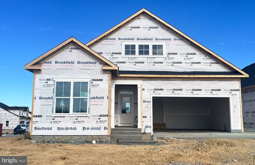 Brand New Main Level home is under construction and with special financing and closing cost assistance available, there is no reason to wait to make this the next place you call home! Located within Hiatt Pointe at Snowden Bridge, an active adult community for those 55 or better!
This Rembrandt, located on a corner lot, a stunning home offering a harmonious blend of private sanctuaries and vibrant communal spaces, all while prioritizing the ease of main-level living. Step through the welcoming covered entryway and into the heart of the home – a light-filled central gathering area seamlessly connecting the expansive family room, a chef-inspired kitchen, and an inviting dining area.
The gourmet kitchen is a true masterpiece, featuring a substantial center island adorned with elegant Calacatta Idillio quartz countertops, full overlay Dayton Birch cabinets, a generously sized walk-in pantry, and gleaming gourmet stainless steel appliances. The open layout ensures effortless flow to the dining area and the comfortable family room. Off of the family room is a rear screened porch, further expanding your indoor/outdoor living space. A versatile room in the front of the home provides the perfect space for a home office, library, or even a more formal dining setting.
Escape to the tranquility of the main-level primary suite, thoughtfully situated in its own private wing. This spacious haven boasts dual walk-in closets and a luxurious en suite bathroom – your personal oasis awaits.
The opposite wing of the main level offers two well-appointed secondary bedrooms and a shared full bathroom, providing comfortable accommodations for family or guests.
A conveniently located laundry room, serving double duty as a mudroom, is easily accessible from the attached two-car garage, keeping your home organized and clutter-free.
Journey down the elegant oak staircase to discover a fantastic walkout lower level, featuring a spacious recreation room perfect for entertaining or relaxation. A lower level den and full bathroom provides even more hosting or flex space. 
Community will offer a gated entrance, bocce & pickleball courts, clubhouse with event room, fitness and yoga studio, outdoor kitchen with gas grill and an outdoor pool with hot tub. Snow, trash and recycling included.