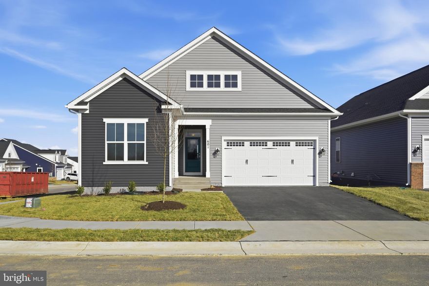 Brand New Main Level home is under construction and with special financing and closing cost assistance available, there is no reason to wait to make this the next place you call home! Located within Hiatt Pointe at Snowden Bridge, an active adult community for those 55 or better!
This Rembrandt, located on a corner lot, a stunning home offering a harmonious blend of private sanctuaries and vibrant communal spaces, all while prioritizing the ease of main-level living. Step through the welcoming covered entryway and into the heart of the home – a light-filled central gathering area seamlessly connecting the expansive family room, a chef-inspired kitchen, and an inviting dining area.
The gourmet kitchen is a true masterpiece, featuring a substantial center island adorned with elegant Calacatta Idillio quartz countertops, full overlay Dayton Birch cabinets, a generously sized walk-in pantry, and gleaming gourmet stainless steel appliances. The open layout ensures effortless flow to the dining area and the comfortable family room. Off of the family room is a rear screened porch, further expanding your indoor/outdoor living space. A versatile room in the front of the home provides the perfect space for a home office, library, or even a more formal dining setting.
Escape to the tranquility of the main-level primary suite, thoughtfully situated in its own private wing. This spacious haven boasts dual walk-in closets and a luxurious en suite bathroom – your personal oasis awaits.
The opposite wing of the main level offers two well-appointed secondary bedrooms and a shared full bathroom, providing comfortable accommodations for family or guests.
A conveniently located laundry room, serving double duty as a mudroom, is easily accessible from the attached two-car garage, keeping your home organized and clutter-free.
Journey down the elegant oak staircase to discover a fantastic walkout lower level, featuring a spacious recreation room perfect for entertaining or relaxation. A lower level den and full bathroom provides even more hosting or flex space. 
Community will offer a gated entrance, bocce & pickleball courts, clubhouse with event room, fitness and yoga studio, outdoor kitchen with gas grill and an outdoor pool with hot tub. Snow, trash and recycling included.