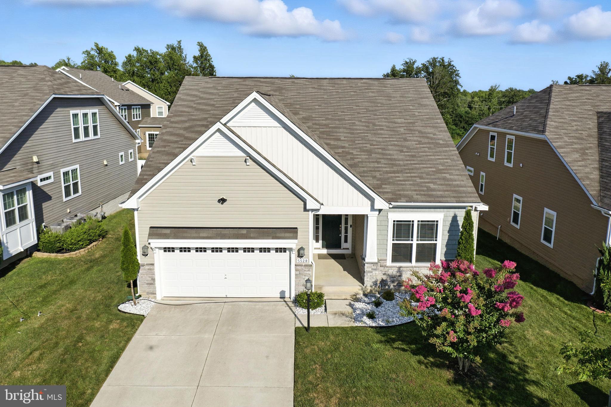 THIS HOME COMES WITH A 3.5% ASSUMABLE VA MORTGAGE RATE SAVING YOU THOUSANDS PER YEAR IN INTEREST PAYMENTS. 5528 Old Colony Ct is easily the best offering to hit the market in the Gleneagles community.
Built in 2018, this thoughtfully designed home combines modern finishes with practical living. With three bedrooms all on the main level, it’s a one story plus basement layout that makes daily living easy and efficient.The home has also been freshly painted and professionally landscaped, giving it a clean, well maintained look both inside and out. The open concept kitchen flows directly into the living and dining areas, creating a comfortable and connected space for everyday life or entertaining.
The kitchen features stainless steel appliances, a gas stove, double oven, and a large center island with pendant lighting, offering plenty of prep space and additional seating. The living room is highlighted by recessed lighting and coffered ceilings that add depth and character.
The primary suite includes a spacious walk in closet and a well appointed bathroom with a dual vanity sink, making the space both functional and comfortable.
A sliding glass door leads from the living area to a private balcony that overlooks the backyard and pond. With no neighbors behind the home, you’ll enjoy added privacy and a peaceful view.
The fully finished basement includes a spacious bonus room and a full bathroom, offering flexibility for a guest suite, home office, or recreational room. A two car attached garage adds convenience for parking and storage.
5528 Old Colony Ct offers a smart layout, quality finishes, and a calm setting, an ideal combination in a well established neighborhood.