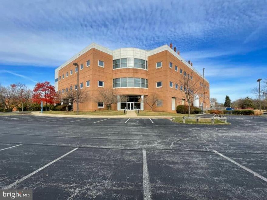 6411 Beckley Street comprises a 77,225 square foot biomedical research office and laboratory building situated on 4.56 acres of industrially zoned and port adjacent land. The life sciences facility is currently 25% occupied by Pixelligent, Inc., a manufacturing company that, according to the company website, is “innovating advanced optical solutions for next-gen electronics applications.” The tenant has extended their lease through May of 2027 with increased rent beginning in June of 2025 ($543,390 gross rent per year). Current operating expenses put the building at a roughly break-even proposition as it stands, with ample opportunity for strategic building improvements to reduce overall operating expenses in addition to 75% remaining space available to occupy or lease. Proximity to the port, industrial zoning and overall acreage also present an exciting opportunity to fully reposition the building to a variety of alternative uses, including cold storage, traditional office or institutional purposes. The auction presents a unique opportunity for a strategic company headquarters, creative redevelopment or simply a well-timed value-add leasing opportunity.
Flexibility: Ideal for a mix of office and lab configurations. Lab space is not mandatory, and the owner is open to modifying the existing lab setups to create additional office space tailored to your needs.
Security: Gated access for enhanced safety and privacy.
This property is strategically located and offers ample room for innovation and collaboration. Whether you're looking to establish a lab, an office, or both, this space presents an excellent opportunity for any growing business. 

For more information or to schedule a tour, please contact us today!