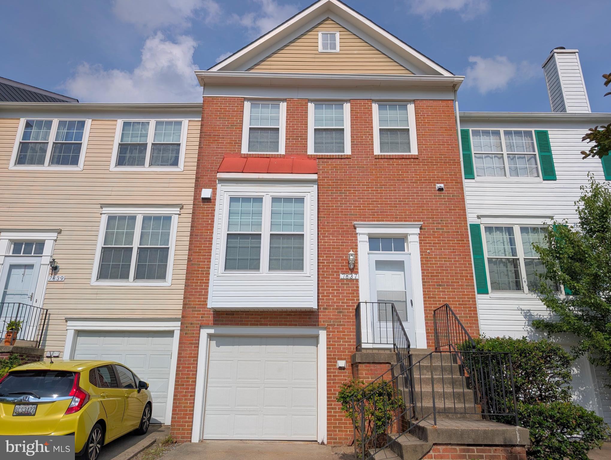 Great value in this sunlit 4-level townhome with garage and driveway. Open living room/dining area with fireplace and large windows. The kitchen also has lots of sunlight and table space. The lower level has a family room, along with the full bath, laundry area and garage entrance. The back doors open onto a fenced yard with stone patio. The outside stairs lead up to a large raised deck off the living room. The 3rd level has a spacious master bedroom with lots of closet space. The master bath has cathedral ceilings & skylight. The upper level has 2 bedrooms and a full bath. Maintenance-free laminate flooring throughout. This home is ready for your personal touches and is priced to sell!