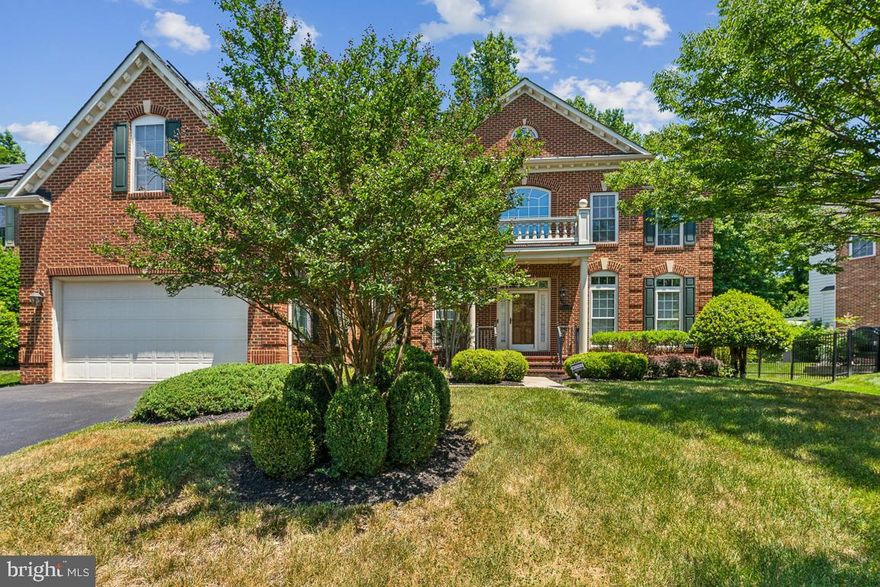Price Improvement! 7,200+ sq ft of luxury. This gorgeous 6 bedroom 6 bathroom colonial in the prestigious GATED community of Oak Creek is a must-see! All bedrooms have an ensuite bath. There's a main-level in-law suite. Massive kitchen with double ovens, new microwave, and refrigerator (2023).  Oversized kitchen island. 2-story foyer along with a 2-story family room with stone fireplace, and a coffered ceiling that spans across the main level. Upstairs you'll find 3 spacious secondary bedrooms and the primary suite, which is a retreat! Enter through double doors to find a spacious main area as well as a sitting room. The primary bath is spacious with double vanity, large shower, and jacuzzi tub. The walk-in closet will put almost anyone's concerns for space at ease. The basement is fully finished! The bar area is complete with sink and microwave. The theater room has a raised level, and the furniture conveys! Enjoy an open recreation area as well as another bedroom and full bath plus a bonus room for additional storage. French door walkout that brings in great natural light.  Outside you'll find a brand new (2022) Trex deck spanning 36 ft across the back of the home. The amenity-rich Oak Creek community has an 18-hole golf course with clubhouse, pro-shop and on-site restaurant. There are also community parks, tennis courts, walking and biking trails, playgrounds and tot lots, scenic lakes with fountains and a community pool with another clubhouse. All with 24-hour on-site security! Subject to existing solar panel lease.