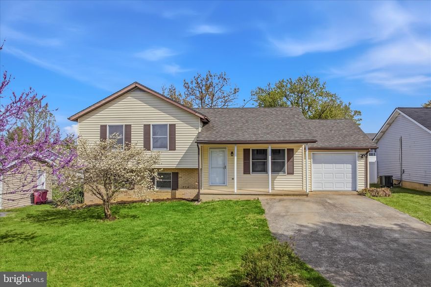 This newly renovated home features three bedrooms and two full baths. Outside you have tons of curb appeal and a long driveway for ample off-street parking.  The one car garage keeps your car, and you, out of the weather. Your large front porch is perfect for enjoying a morning coffee. Inside the spacious living room features new LVP floors, a ceiling fan, and tons of natural light. Beyond this you have an updated eat-in kitchen with stainless steel appliances, granite countertops, and access to your large rear deck. The upper level of the home features new carpet throughout. Two generously sized bedrooms feature large windows for lots of natural light and ample closet storage.  The hall bathroom features a new single bowl vanity with granite countertop and tub/shower. The primary suite features a ceiling fan light fixture to keep the space nice and cool in the upcoming months. You have a private ensuite full bath with updated vanity and walk-in shower.  The lower level of the home is a huge family room with new LVP floors. Your laundry is also on the lower level. This keeps your machines neatly tucked away and provides a nice space for extra storage. Outside you have a large rear deck with a built-in bench. This will be a great space to host your Summer BBQs. Stairs walkdown to your lush, level yard. It's already fenced and ready for your furry friends. This one is sure to go quickly - schedule your showing today!