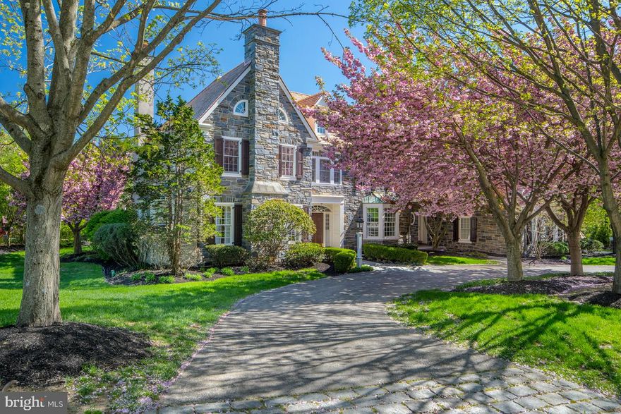Conceived by the preeminent Pohlig Builders, this exceptional Villanova manor home epitomizes gracious living on the coveted Main Line in a superior setting and neighborhood! Privately set on expansive lush property in exclusive Harriton Farm, across from lovely dedicated meadow space, is a showplace of quality and award-winning design. The flowering trees, manicured shrubbery, stretching green lawn, and a circular drive enhance the environs of the stunning stone & stucco exterior. The large, lovely property is perfectly suited for sports, recreation, gardening, and more. You ll appreciate the views and tranquility from your generous outdoor patio with a pergola. The expansive, impeccably-designed interior is introduced by an elegant foyer with a wide arched opening and view of the grand staircase & rear outdoor oasis beyond. Exquisite detailing, millwork, crown moldings & luxury updates beautify the ambience throughout, complemented by airy ceilings & a fabulous floorplan for family living/entertaining. Two stories of elegant quarters with 5 bedrooms & 5.2 baths plus a full finished basement with fabulous amenities create an atmosphere you can t resist coming home. The open flow of the main level is ideal for the host, with a spacious living room with fireplace & formal dining room on either side of the foyer. A wet bar off the dining room affords easy serving & connects to the enormous eat-in kitchen. This heart of the home features a huge furniture-quality island with seating, abundant cabinet storage, a walk-in pantry, premium appliances, and workstation area for doing bills & homework. Breakfast is delightful in the open morning room enveloped by windows, with glass doors to the large bluestone patio. Relax in the sunken family room with a coffered ceiling, fireplace & built-in TV station for watching movies. A library, mudroom with cubbies & 2 powder rooms complete the comfort of the 1st floor. Upstairs presents 5 well-proportioned bedrooms including a serene master suite with a dressing room & luxurious spa bath. The lower level haven offers an office, sauna, mirrored gym, game room, full bar, lounge/media area & wine cellar. A den, laundry room, new cedar shake roof (April 2019), unfinished attic, security system & 3-car garage round out the appeal. Your quiet family retreat sits in a convenient location minutes shopping, dining, transportation, excellent Lower Merion schools & Philadelphia. RE TAXES UNDER APPEAL.