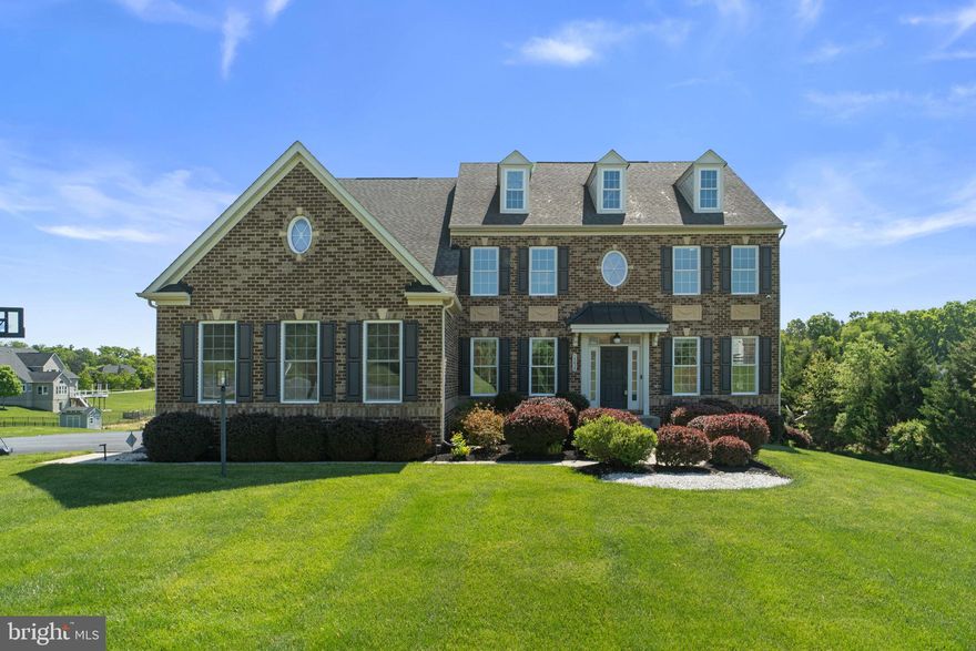 COMING SOON — Gorgeous homesite showcasing a stately Colonial in sought-after Warfields II, presenting an exceptional blend of timeless elegance and modern comfort. // Thoughtfully designed for both everyday living and refined entertaining, this nearly 6,000 square foot residence offers exceptional scale, beautifully appointed interiors, and inviting outdoor living. The well-appointed home features a private study, sunlit breakfast room, formal dining and living rooms, and a dramatic two-story family room with a striking stone-faced gas fireplace. The gourmet eat-in kitchen is complemented by stainless steel appliances and granite countertops. The luxurious owner’s suite offers a sitting room, a private balcony, and a spa-like ensuite. Additional highlights include two laundry rooms and a fully equipped in-law suite with a complete kitchen, providing ideal flexibility for extended living. The picturesque grounds are enhanced by a stamped concrete patio and an elevated deck overlooking scenic farmland. // 14838 Michele Drive is a truly remarkable offering where elegance, comfort, and exceptional setting converge. Additional details and private preview opportunities coming soon.