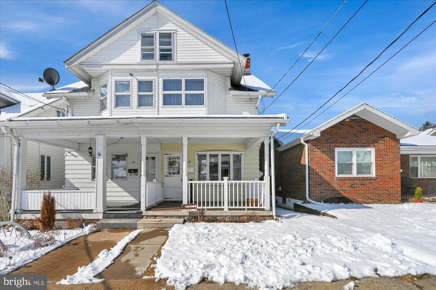 Nice move-in ready twin home with a garage and fenced yard.   Welcoming front porch.  Large open living room, main floor laundry & half bath.  Generously sized and updated kitchen with porch access to a fully fenced-in rear yard.  Upstairs find 4 bedrooms (one is a walk-through), with a full bath and access to the attic.  One car garage in back with off street parking for a compact car.