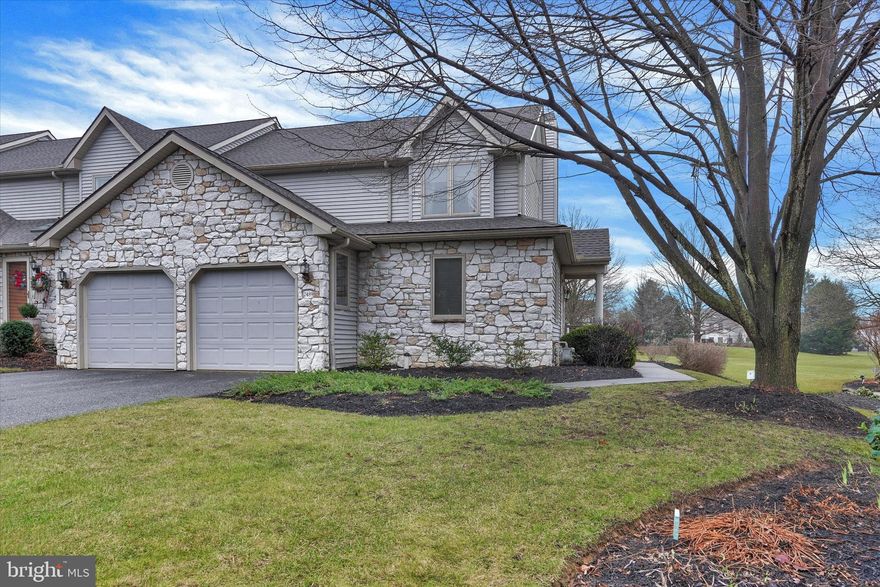 Beautifully maintained end unit with 2 car garage and large common area behind the home.  Hardwood floors throughout the first floor and 2 story family room with balcony and gas fireplace.  Large dining room/kitchen combo with updated SS appliances and bump-out in the dining room.  Primary bedroom includes vaulted ceiling, walk-in closety and upgraded bath with whirlpool tub, double vanity, and separate shower.  2nd floor includes an office area with balcony overlooking the family room.  Very nice community in Heritage Hills