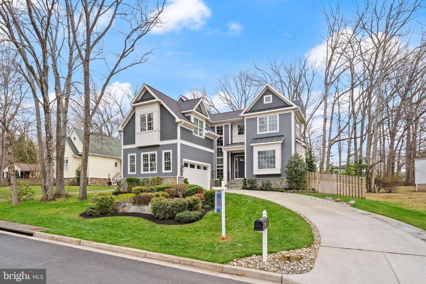 Tucked along a quiet, tree-lined street in the heart of Vienna, this extraordinary custom residence offers a rare blend of refined luxury and effortless everyday living. Just moments from the charm of Maple Avenue—where boutique shopping, acclaimed dining, and community gatherings create a vibrant yet intimate atmosphere—this home delivers both serenity and connection in one of Northern Virginia’s most coveted settings.

From the moment you arrive, the home’s presence is unmistakable. Thoughtfully designed and impeccably constructed, it reflects a commitment to enduring quality and timeless elegance. A sophisticated exterior palette, accented by architectural roofing and clean-lined detailing, sets the tone for what lies within.

Inside, light-filled spaces unfold with intention and grace. Custom millwork, elegant trim details, and carefully curated finishes create an atmosphere that feels both elevated and inviting. The heart of the home is a beautifully appointed kitchen designed to inspire—where form meets function in a seamless balance of craftsmanship and comfort—flowing naturally into living spaces made for both quiet moments and memorable gatherings.

Designed with both luxury and livability in mind, the home features a private elevator that provides seamless access to each level—enhancing convenience while ensuring the home remains functional and accessible for years to come.

Every detail has been considered to enhance daily living. Spa-inspired baths offer a sense of retreat, while energy-efficient systems and modern infrastructure ensure comfort without compromise. The home is as functional as it is beautiful, designed to support the rhythm of contemporary life with ease.

Beyond the interiors, the experience continues outdoors. A generous flagstone patio invites al fresco entertaining, anchored by a custom stone fire feature that creates a warm, intimate ambiance year-round. Softly illuminated seating walls and a spacious rear deck provide the perfect backdrop for everything from relaxed evenings to lively celebrations.

Here, lifestyle is as compelling as the home itself. Enjoy morning walks through nearby parks, evenings in town, and the convenience of effortless access to major commuter routes and Metro—while always returning to a setting that feels distinctly private and peaceful.

This is more than a home—it is a place to live beautifully, entertain effortlessly, and experience the very best of Vienna living.