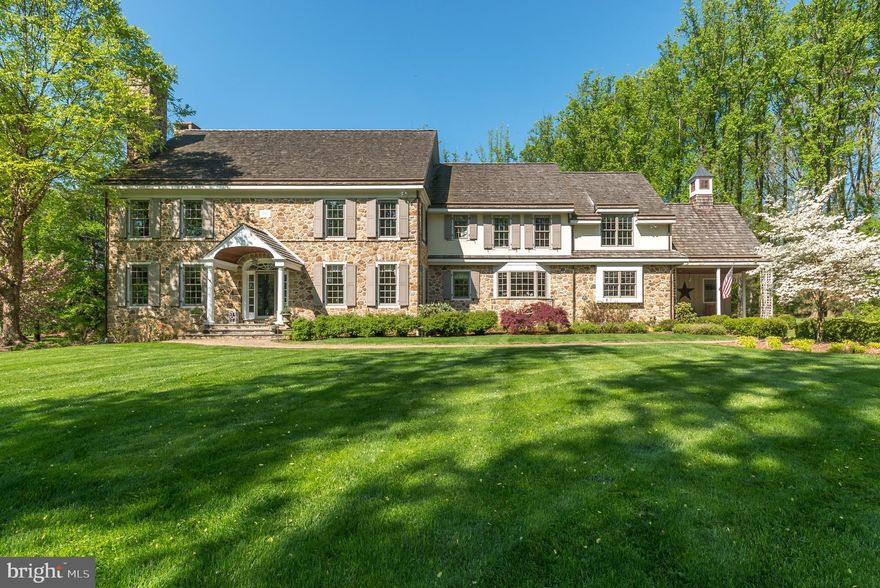 Beautiful hand-crafted stone farmhouse is nestled on 2.9 private acres abutting trails of Valley Creek Nature Preserve, in a family neighborhood in desirable Tredyffrin Township.  Conveniently located to the Paoli Train Station (Great Valley Flyer) & prestigious private academies. Stunning curbside appeal, complete privacy & gorgeous views are delightful. The custom designed 7,400 sf home is breathtaking - mmeticulously landscaped, the natural stone embraces the entire exterior highlighted w/keystone arches, flagstone patios, copper roofing, downspouts & gutters, stone chimneys & cedar shake roof.  A brick paver walkway welcomes guests into the spacious foyer, brightened by a large triple window overlooking the rear property, one of the home s many idyllic vistas.  Architectural details include craftmanship millwork, antique random width heart pine floors, 3 fireplaces, French doors, cherry cabinetry, 9  ceilings, and more.  The many windows, doors & skylights offer a virtual panorama of the stunning property throughout the home. Enjoy casual elegance in the spacious living room(FP), dining room, den (FP), wide hallways & large foyer perfectly suited for formal entertaining & easy mingling.  The French sliders to the flagstone patios enhance indoor/outdoor entertaining.  More intimate gatherings are enjoyed in the open concept kitchen & dining nook w/French slider to a flagstone patio w/propane line for grilling.  The gourmet kitchen is a cook s dream w/SS appliances, Thermador gas cooktop, cherry cabinetry & granite tops for easy meal prep.  From the kitchen island, be greeted with morning sunrises out the bay window while enjoying nature s delights of the picturesque back yard. Spend memorable evenings in the large FR cozying up to the stone FP (wood burning) surrounded by custom cherry bookcases & bench seating.  The rear bank of transom windows, French slider & skylights bring the outdoors in all year round & create a charming gathering spot for family.  Radiant floor heating in the tiled sun room keeps it warm & comfortable all winter. A large mud room w/cherry cubbies, laundry room, full bath all with tiled radiant floor heating & rear staircase complete the first floor.   The bright & airy home basks in sunshine & warmth all day & the open floor plan with wider halls maximize flow.  French doors allow for ease of indoor/outdoor entertaining on the flagstone patios while enjoying bucolic views of the gardens & nature preserve virtually everywhere in the home.  The grand staircase is brightened by a triple window leading to the 2nd floor featuring cherry hardwood floors, 8  ceilings, study area w/cherry cabinets, cedar closet and a full walk up attic for future expansion (w/two heat-controlled HVAC rooms). The secluded master bedroom/bath with a separate HVAC unit is a private retreat including large walk in shower, radiant floor heat & soaking tub perfectly placed to relax and absorb the idyllic landscape.  5 generously sized bedrooms & 3 baths w/radiant heating, linen closets & rear staircase down to mud room ensure that family & guests are comfortable. Full daylight basement w/poured concrete walls include large finished area for recreation, exercise room, 2 HW heaters (2014), electric service 400+ amps, controls for radiant heating & whole house generator, Lutron lighting, egress stairs to garage & ample storage. Exterior includes 2 stone surround patios, morning porch w/Dutch door, lighted cupola, 3 car garage, two 1000-gallon buried propane tanks, central vacuum system, well-fed lawn irrigation system, spring house, security cameras, flat expansive yard for activities, buried PECO lines & full sunshine.  Home is freshly painted with 7 zone HVAC for optimum comfort. Perfection is an understatement to describe this paradise in prestigious TESD tucked away in its  own country niche. A rare find & charming private retreat in a quiet peaceful neighborhood with easy access to highways, nature trails & Valley Forge Park.
