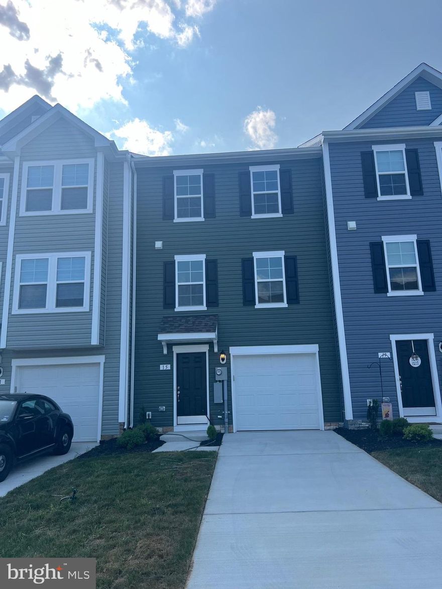 DRB Homes Overlook at Riverside - For GPS: The Property is in Next to this address: 42 Belmont Pl FALLING Waters, WV 25419...Next to Children / Dog Park - Brand New Town Home 4 Bed Rooms, 3.5 Bath, Upon entry of this wonderful townhome, a finished rec room (can use as a 4th Bed Room) with a full bathroom. The main level offers luxury vinyl plank flooring throughout and a spacious living room with a powder room. The eat-in kitchen features an island, Quartz countertops and stainless steel appliances with Composite Deck. The spacious primary suite features a generous walk-in closet and an en suite bath with a dual sink vanity and an oversized seated shower. Two secondary bedrooms & full bath, a linen closet and a centrally located laundry complete the upper level! Set in a wonderful new community, Dog Park, Children's park, Basket Ball Court, Tennis Court, and Recreation sit up area are free amenities. In a prime location for I-81, Rt 11, I-70 commuters, mountain views, walking distance to shopping, and restaurants, access to Spring Mills schools, and close to interstate just minutes from the MD line. This rental may not last long.