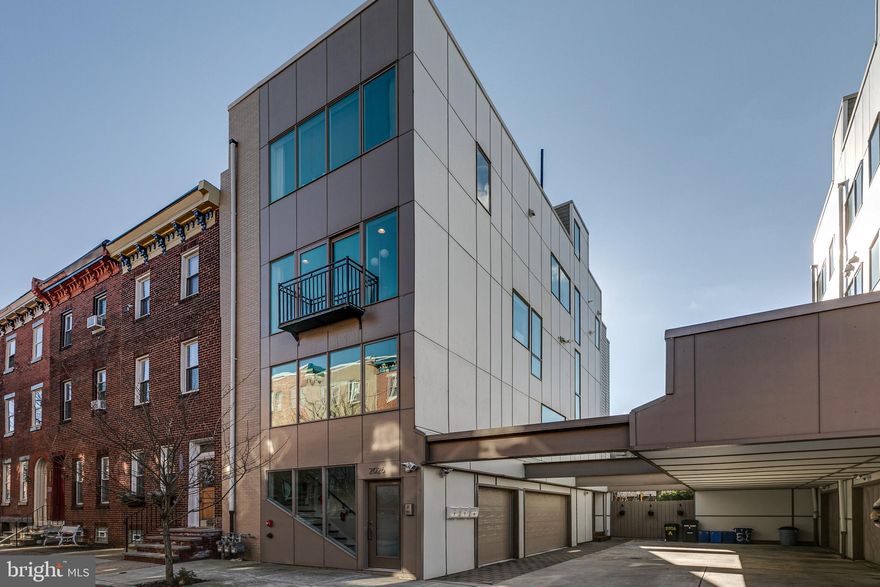 Welcome to 2026 Ogden St. #C! This corner unit, bi-level 2 bed, 1 bath condo with 1 car attached garage parking will not last long. Currently 5 years still remaining on the tax ABATEMENT! This luxurious condo features solid oak floors, oak treads, corner windows, a beautiful modern kitchen with grey quartz counters, stainless steel appliances and an open living area with gas fireplace and stone accent wall that leads to a Juliet balcony with sliding doors flooding the entire floor with natural light. The first level also features a large utility room with washer/dryer and space for added storage. Upstairs you'll find two spacious bedrooms both with ample closet space and an exquisitely tiled hall bathroom with modern vanity and 60" tub. Outside you have your own half of the roof deck with exceptional city views and lots of outdoor living space, perfect for entertaining. With easy access to Center City, high-end, eye-catching finishes, private outdoor space and garage parking, this home checks all the boxes for a perfect place to call home.