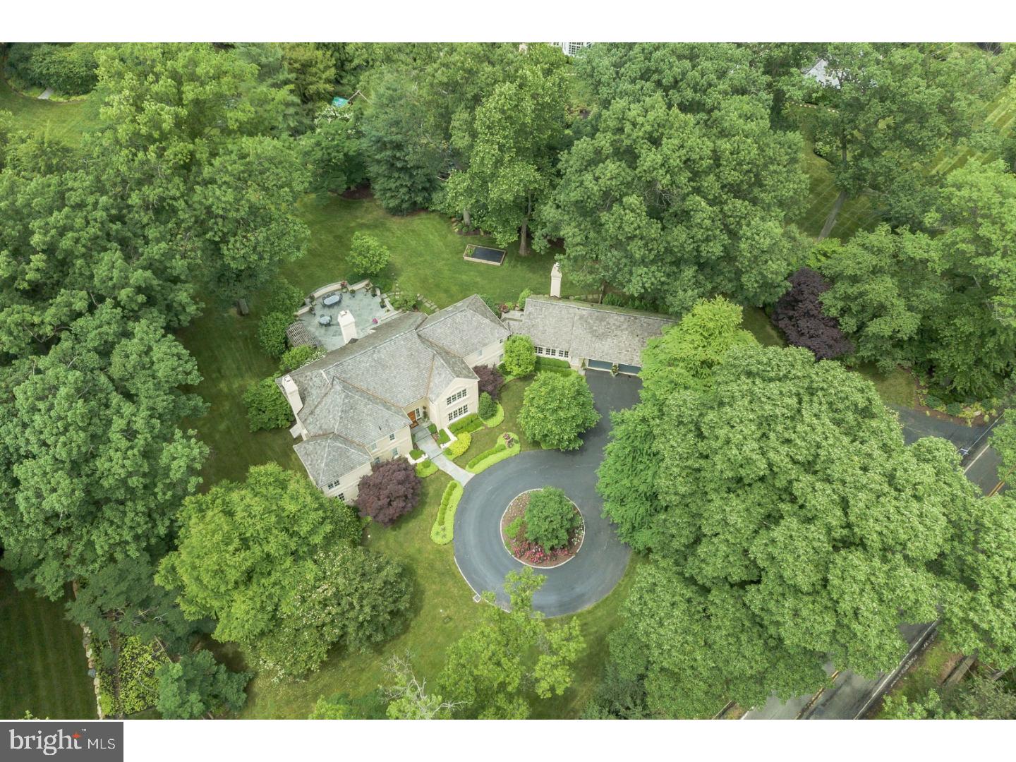 NEW DECORATOR COLORS make this home look like NEW CONSTRUCTION! Vincent Kling, Jr. designed and built this exquisite home featuring the most beautiful BACKYARD which is just under 2 Acres and cannot be appreciated from the street! Today's owners have recently renovated this 29 year old traditional style home for today's upscale living pleasure with extensive attention to detail and high end finishes. The neighborhood is the Gold Coast of Radnor Township sharing the historic Ardrossan location with new construction and many coveted estates. The circular driveway approach features specialty plantings and this home's stately architecture. As one enters the grand Center Foyer you are immediately taken by the improvements which present themselves as new construction: fresh painting and designer wall coverings, elaborate moldings and gleaming hardwood/marble and limestone floors only to mention a few. Step down to the celestial ceiling Family Rm with custom fireplace mantle and Atrium Doors with Palladian tops which exit to the expansive terrace for entertaining. Step up to a spacious Gourmet Kitchen featuring marble counter tops,Bosch Dishwasher,Wolf 5 Burner Cook Top,Sub Zero Refrigerator and Dacor ovens. From the vaulted, beamed Eating Area in the Kitchen walk out to the PA blue stone walled terrace with flowering Pergola seating area and breathtaking view of the backyard. A Butler Pantry with outside exit features a soapstone counter top and Bar frig. The exquisitely appointed back Powder Room offers Chicago brick flooring,soapstone vanity top and a custom mirror. A skylit Breezeway leads to the enchanting Guest En Suite with still another custom fireplace and outside exit to private terrace and backyard. The 3 car Garage is off the right wing of the home and includes generous storage. To the left of the Entrance Foyer is the front to back sunken Living Room with Built-ins including a bay window seat and still another custom tile fireplace. The Office is faux painted with built in bookshelves and lovely view. Another Wet Bar and a custom appointed Guest Powder Room with recessed mirror complete this wing of the home. The tray ceiling Master Bedroom offers 2 generous walk-in closets with systems, marble His and Her Baths, Soaking Tub and Stall Shower. Three additional Bedrooms; one En Suite and magnificently appointed Bathrooms of Rohl or Kohler fixtures and specialty ceramics complete the second level floor plan. 3 Zone heat at a very low annual expense.