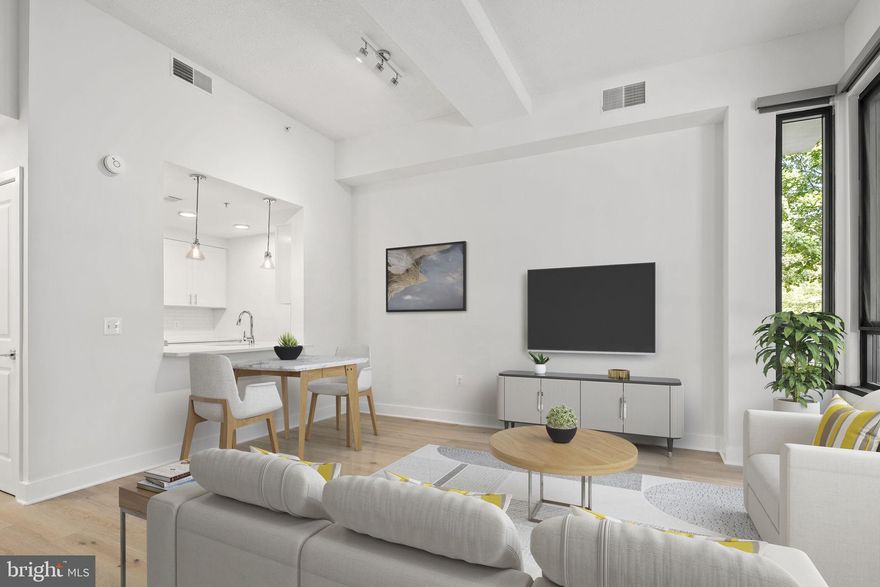 Stunning luxury townhome fully renovated with top-of-the-line amenities. This three level home provides open concept living with 9' ceilings and floor to ceiling windows. It features a gorgeous kitchen with brand new stainless appliances, quartz countertops, and a powder room. On the second floor is the primary suite, full bath and laundry, with two additional bedrooms above. Enjoy the best of both worlds as this home includes the privacy of a townhome, but also a  reserved parking space in the garage, a storage unit, and full access to the Odyssey's amenities: pool, rooftop terrace with monument view, gym, entertainment room and 24 hour concierge/management. Located on a quiet tree lined streets, just steps from the Courthouse Metro, shops and dining. 2 miles to DC and 4 miles to Reagan National Airport.