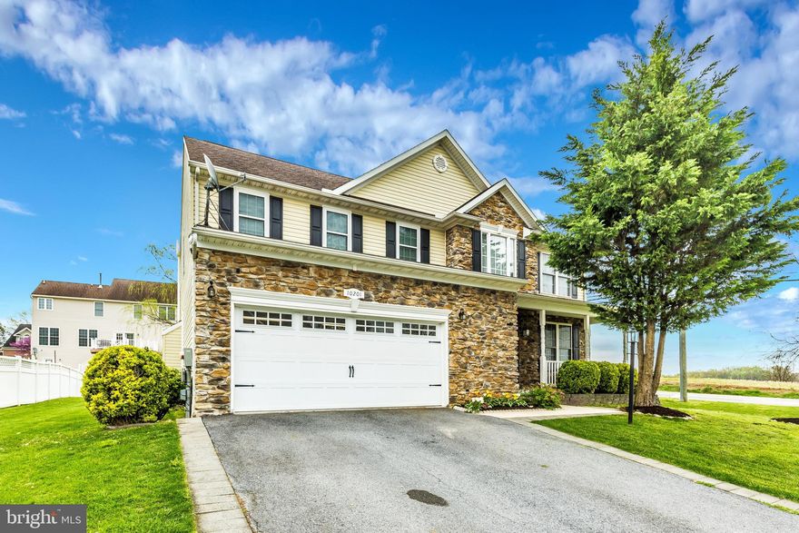 Perfectly located on a corner lot across the street from open fields. This spacious 4 bedroom, 3.5 bathroom house boasts 3,604 finished sqft. The large eat-in kitchen with island opens right into the family room with stone fireplace. From the kitchen, access the back deck and beautifully landscaped yard with patio. Relax in the master suite with large walk-in closet, double sinks, walk-in shower and jacuzzi tub --- the perfect place to get away from it all. The Jack and Jill bathroom upstairs also has a door to the hallway for access from the 4th bedroom. Want even more living space? The fully finished basement features a rec room, full bath, and a bonus room that could serve as a 5th bedroom. Close to major commuter routes, shopping and dining. No HOA means no nonsense!