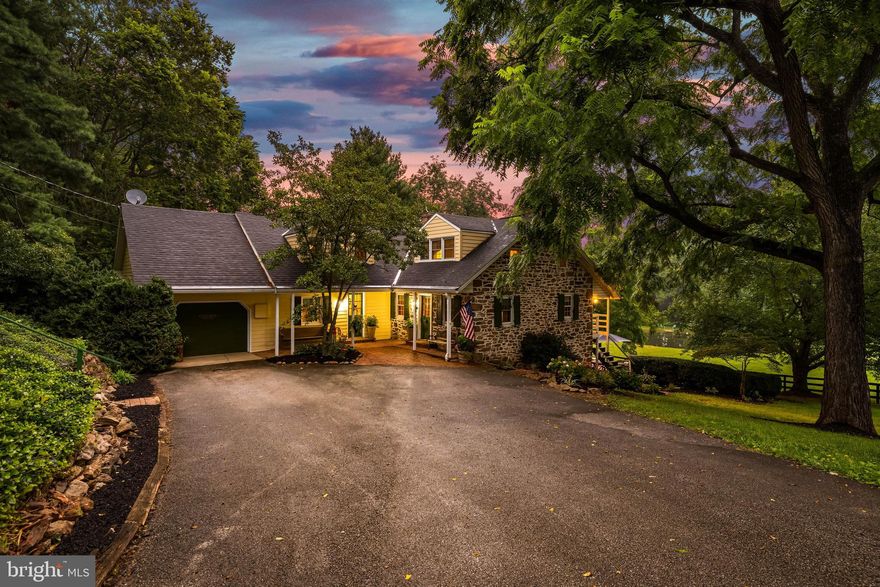Welcome home to The Little Green Farm. This Farm consists of approx 31.5 acres, consisting of three separate parcels- potential to subdivide and bring the family. The home circa 1850, is a stone Cape Cod style residence offering over 3,300 sqft of living space. The property boasts peace and privacy at the end of a 1/4 mile tree-lined driveway- leading to the house, which includes hardwood floors, exposed beams, multiple bold stone fireplaces, and more. The kitchen has granite counters, a large L shaped island, stainless steel appliances, and access to a rear deck- perfect for coffee or a drink overlooking the pond and lower pasture. A formal dining room, den, and family room are located on the main level, along with a galley-style laundry and mud room. The lower level includes a living area/den, a bedroom, a full bath, and access to a gorgeous brick patio and the property’s springhouse. The springhouse is currently wired for electric and includes a bar area! Other outbuildings include a bank barn with three horse stalls and two pony stalls, a detached oversized garage with a workshop, and a tack/supply building. The land has fenced pasture, tillable (and fence-able) acreage under Clean and Green tax designation, Outdoor Riding Arena, and a pond. Upgrades include a new furnace  (2024) and has central air conditioning. It offers a great potential for equestrian activities, and/or as a large private multi-family residence. A little over 10 miles from the MD/PA line, this is convenient yet secluded! Schedule your private tour today!
