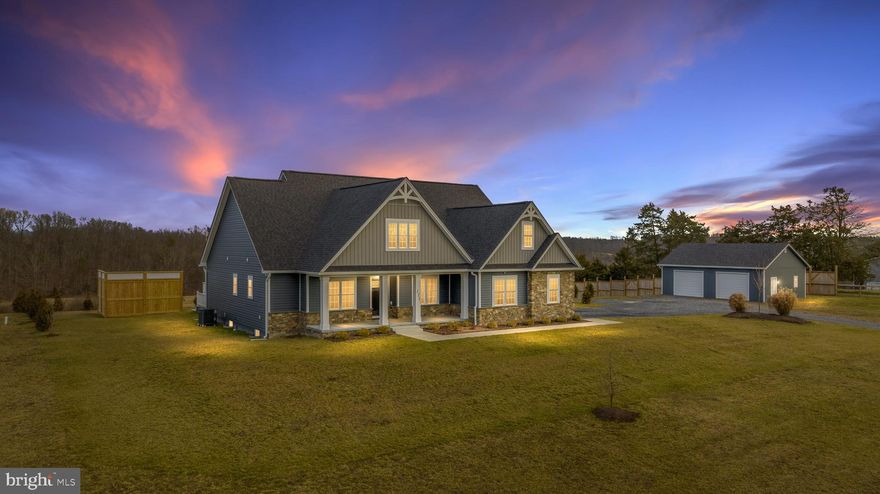 *Back on market through no fault of seller* Are you in search of both acreage and high-speed wired fiber internet? Look no further – we have the perfect home for you! Less than three years old and boasting numerous upgrades, this residence is ready for you to move in and relish the breathtaking view of 9.5 acres with trees and mountains as your scenic backdrop, especially while lounging by the pool.

Inside, the open floor plan, gourmet kitchen, and elevated/tray ceilings contribute to the home's appeal. The main level showcases a primary suite with a full bath, walk-in closet, and a private door leading to the screened porch. Additionally, there are two secondary bedrooms and a dedicated office space with French doors.

The lower level offers a massive rec room, a third full bathroom, and not one but two bonus rooms with oversized closets, versatile enough for use as bedrooms, craft rooms, or exercise spaces. All this and there is still over 400 sq ft of unfinished storage space. Did you noticed the 34' x 26' detached garage? It provides ample room for storage plus all your project work.

Enhancing the property's security is an 8-camera system surrounding the home, while a whole house water softener, treatment, and filtration system round out this exceptional package. This home combines functionality and luxury, creating an outstanding living experience.