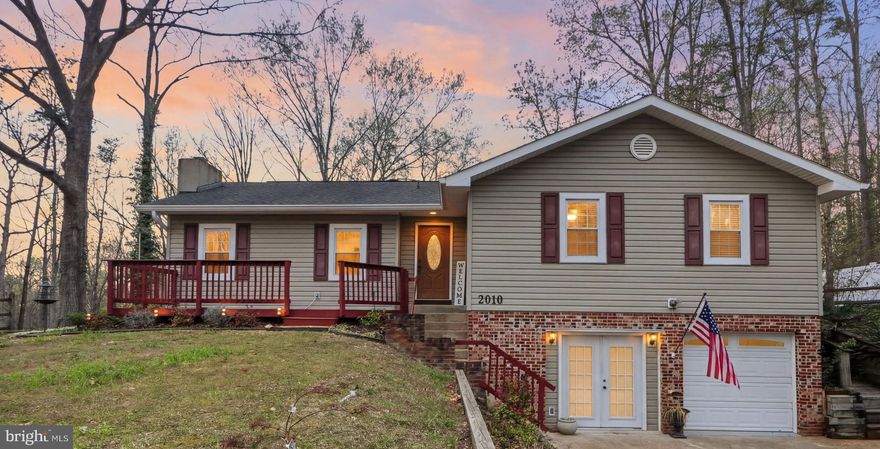 Welcome to 2010 Buoy Drive in the highly sought after community of Aquia Harbour in Stafford, VA where lifestyle, comfort, and thoughtful updates come together beautifully!

The main level showcases tile flooring in the living, dining, and kitchen areas, while newer hardwood flooring extends throughout all bedrooms and the office.  The cozy wood-burning fireplace has been stylishly refreshed with updated paint and a new mantel and it creates a warm and inviting gathering space in the living room.   The updated kitchen features 42” cabinets, granite countertops, stainless steel appliances, and a center island, which are all perfect for entertaining and everyday living!

The primary suite offers a private retreat with a walk-in closet, a completely renovated spa-like bathroom with ceramic tile finishes, and an expansive tiled sunroom featuring three walls of windows. Step directly from the sunroom onto the large, tiered rear deck recently refinished and complete with a gazebo that conveys, overlooking the large fully fenced backyard. Additionally, there's a storage shed wired for electricity which adds functionality and flexibility.   

The other 2 bedrooms are good sized, and there's a second living area on the main level that is a great flexible space for whatever your heart desires!  All bathrooms have been thoughtfully updated with new vanities and ceramic tile on the floors and walls. The finished lower level is perfect for a guest area or recreation/office space.  Additional recent updates include:  painted throughout in 2025, newly installed fans and light fixtures throughout, wainscoting in one of the bedrooms,  and professionally cleaned air ducts in the fall.

Living in Aquia Harbour means access to exceptional amenities:
• Marina with boat ramp, fishing pier, and kayak/canoe launches
• Golf course with pro shop, driving range, putting green, and the renowned Clubhouse at Aquia Harbour Restaurant
• Two pools
• Dog park
• Horse stables & riding trails
• Tennis and basketball courts
• Eight additional parks with tot lots
• Community garden
• Secure storage lot
• Walking trails
• On-site police and fire departments

Plus, enjoy quick access to I-95, Quantico, and nearby shopping and dining!

This is more than a home, it’s a lifestyle thoughtfully upgraded and maintained, and perfectly positioned within one of Stafford’s premier gated communities, 2010 Buoy Drive is ready to welcome its next owners today!