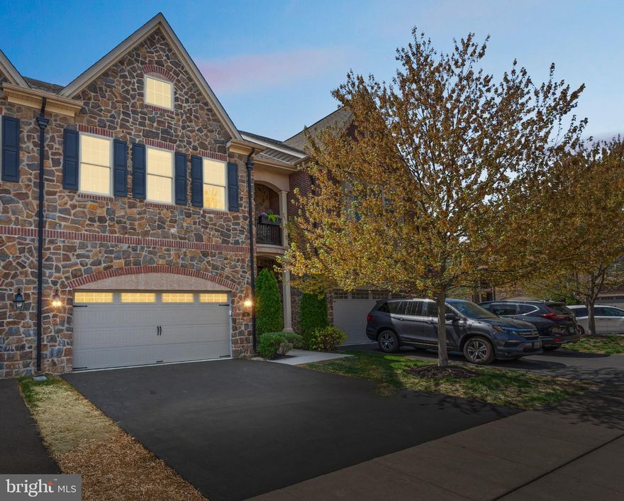 Welcome to Walden Square, A Rarely offered, Simply Stunning town home in a community that has that old world elegance in build and design. 52 David Drive is situated on one of the premier interior lots in the community, a short walk to quaint downtown Newtown borough with restaurants, shops, farmers market and more, located in a superior zip code of Bucks County, and built with all offered top of the line upgrades, rounded corner walls, with the exception of the finished basement. Top of the line surround sound speakers throughout the home that allows you to enjoy different music from each room or enjoy your favorite movie with theater quality surround sound. This home featuring custom closets, window dressings and lighting fixtures throughout. Pull up and behold, perfection in this townhome. Elegantly appointed with substantial hardwood flooring on the first  floor, a gourmet /chef style kitchen with top of the line MONOGRAM appliances, even a convection oven, Carrara marble counters and Island. A huge open first floor plan ..encompassing kitchen living and dining, the dining room offers Coffered ceilings, Wainscoting from the foyers to the dining area, living room you'll find a gas stone fireplace tucked in the corner and a relaxing backyard deck. Upstairs you'll find a large Primary suite that has a 5 star hotel quality  like design, great natural light with sitting area, several Grand chandeliers, two nicely appointed walk in closets on the way to your Carrara marble covered primary suite bathroom with soaking tub and separate walk-in shower, on the other side of this suite you will find a Luxurious dressing room with a wonderful grand chandelier, custom shelving throughout ,plenty of storage, a sitting area and its own private Juliet balcony to enjoy your morning coffee and listen to nature. Making your way down the hall you'll find a large walk in laundry room, 2 bedroom's ,one with is own ensuite full bath nicely appointed with Carrara marble ,then a hall full bath with the same Carrara marble. Making your way down to the unfinished lower level full  unfinished basement just waiting for you to put your final touches on this perfect townhome and make it your own. Let's not forget the large 2 car garage with brand new epoxy flooring. Poised in the back area of the development, truly serene. Come home to 52 David Dr., simply unpack and begin to enjoy your luxury care free living . If there is inclement weather please wear booties  at the front door over shoes, or remove shoes