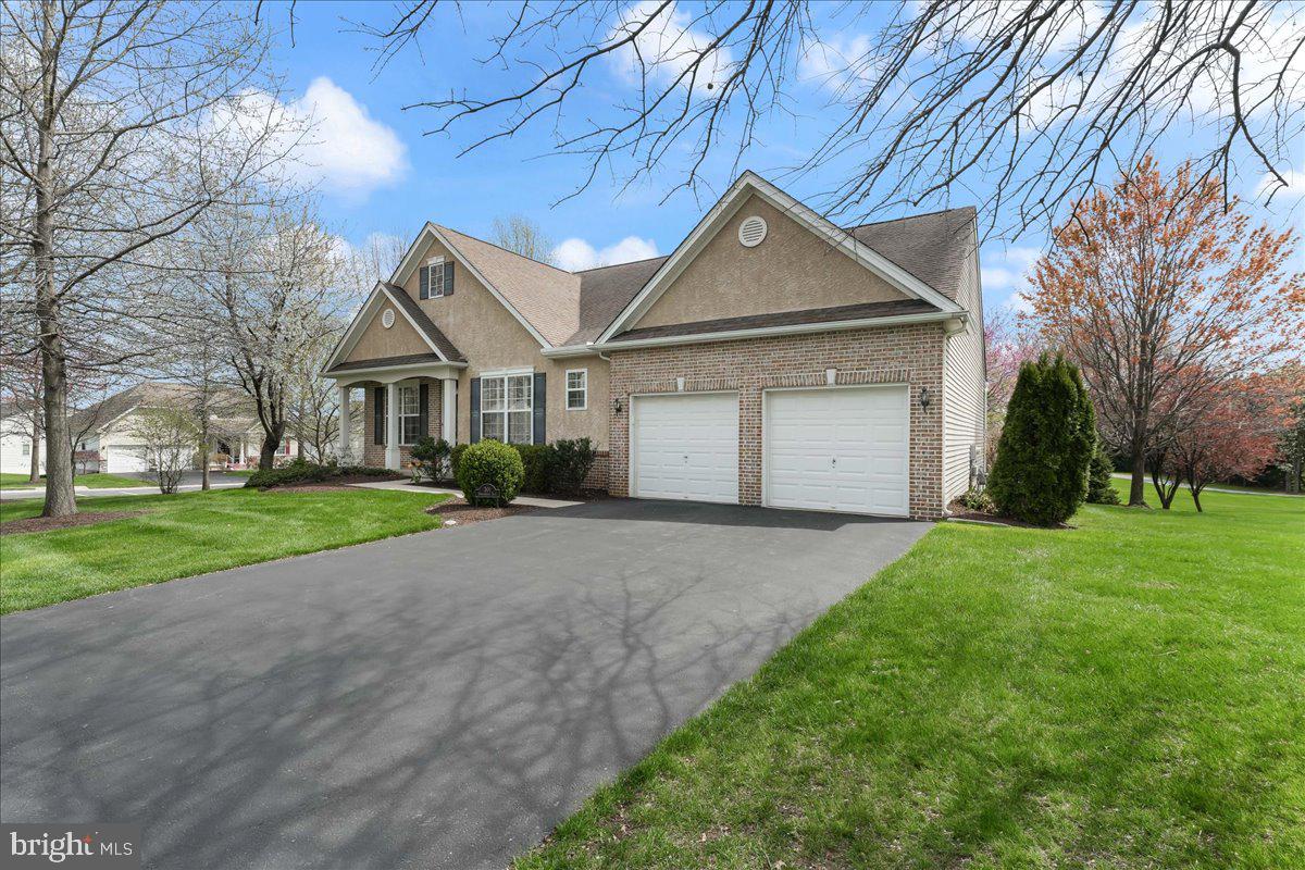 Quick Settlement possible. Welcome to 301 Whitestone Rd in Traditions of Inniscrone, a highly desirable 55+ community in Southern Chester County. This lovely 2 bedroom home on a fantastic corner lot features an open floor plan with hardwood floors on the 1st floor, a living and dining room, a great room with a gas fireplace, 2 bedrooms, 2 baths and a 2nd story loft. The primary bedroom has a vaulted ceiling, large walk-in closet and built cabinets and drawer system. The loft is perfect for a craft area, home office or overflow for guests. The spacious basement has ample storage and a bonus half bath. Recent updates include new paint in several of the rooms, new HVAC just replaced, new carpet in the loft and new appliances in the kitchen. Traditions at Inniscrone has a lovely clubhouse, sidewalks for walking and is conveniently located minutes from shopping and the DE line.