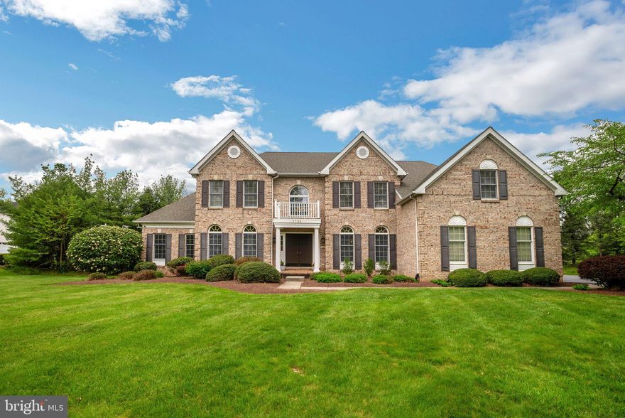 This exquisite Colonial residence boasts a commanding presence with its striking brick facade, nestled on an expansive acre lot within the prestigious Devonshire Neighborhood. Set back on a tranquil cul-de-sac, this home offers unparalleled curb appeal, featuring lush green lawns and meticulously manicured landscaping. Upon entering the covered entryway through elegant double front doors, you're greeted by gleaming hardwood floors that flow seamlessly throughout the majority of the home, complemented by a soaring two-story foyer. The attention to detail is evident with intricate moldings adorning every corner, including crown moldings, chair rail, decorative moldings, and trim around the windows. The inviting Living Room, adorned with a sophisticated two-tone accent paint, leads gracefully into the spacious Great Room through French Doors. Illuminated by natural light and accentuated by vaulted ceilings, the Great Room exudes a sense of airiness and charm. Entertaining is effortless with the seamless flow between the Dining Room and the generously sized Kitchen. The well-appointed center island kitchen features built-in Stainless Steel appliances, granite countertops, and ample storage, accompanied by a convenient eat-in area for casual dining. Adjacent to the kitchen is a conveniently located laundry room with a built in tub,  additional cabinets and a double closet. You can access the garage and the rear deck from the laundry.  A hidden secondary staircase adds practicality to the layout, while the adjacent Breakfast Room provides access to the expansive deck, perfect for outdoor gatherings. The expanded two-story Family Room offers a grand ambiance, complete with vaulted ceilings and a cozy wood-burning fireplace, ideal for unwinding after a long day. Adjacent to the Family Room, the Study, separated by stately columns, offers versatility as a home office or computer room. Retreat to the luxurious Primary Bedroom suite, boasting coffered ceilings and a three-sided gas fireplace shared with the sitting area. The expansive walk-in closet and en-suite bathroom, featuring vaulted ceilings, separate vanities, whirlpool tub, and a glass-enclosed shower, provide a serene sanctuary. Additional bedrooms include a "princess suite" and two well-appointed bedrooms sharing a Jack and Jill bathroom. Master bath has some updates and the other 2 baths upstairs  have recently been completely remodeled. The lower level, unfinished but pre-plumbed for a full bath, offers endless possibilities for customization. Outside, the fenced backyard is a private oasis, (property goes all the way back to Quarry Rd, and the storm water inlet to the right with your back to the house marks the property line) featuring a huge deck perfect for outdoor entertaining, a gazebo for shaded relaxation, and a paver patio with a hot tub (as is seller never used) for ultimate comfort. This meticulously maintained home boasts numerous upgrades, including a wired portable generator, a three-zoned HVAC system, a newer roof, and  hot water heater. Located in Lower Makefield Township within the award-winning Pennsbury School District and sending area for Afton Elementary school, with convenient access to shopping, dining, and major commuting routes, this home offers the epitome of luxurious living. Don't miss the opportunity to make it yours in today's competitive market. Schedule your showing before it's too late!