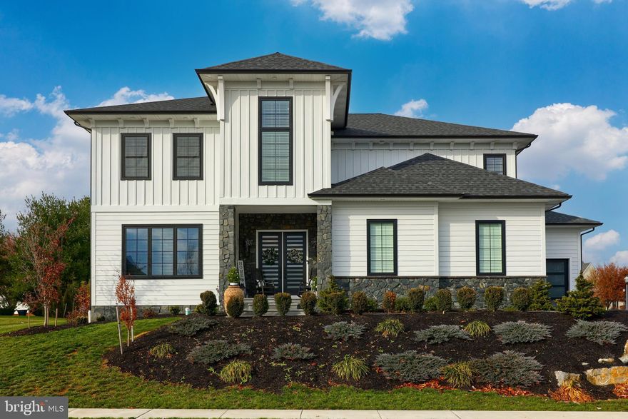 Welcome to your dream home! This stunning 4-bedroom, 4.5-bathroom residence, with 9-foot ceilings spans 4,446 square feet, and is a masterpiece of design and craftsmanship with a new Custom Plan from Costello Builder’s. Nestled in the Manheim Township neighborhood of Stonehenge Reserve, this property seamlessly blends luxury and functionality. The open floor plan effortlessly connects the main living areas, creating a seamless flow from room to room. The spacious family room, featuring a cozy fireplace, built-ins, and a coffered ceiling, is the heart of the home—perfect for both relaxation and entertainment. The gourmet kitchen is a chef's delight, featuring a central island, granite countertops, wet bar with sink and custom refreshment refrigerator, tile backsplash, and custom ambience lighting under as well as inside cabinetry. Large windows throughout the home allow for an abundance of natural light, creating a bright and welcoming atmosphere, and for added privacy, the windows are fitted with a tinted finish, ensuring comfort without compromising the view. The primary suite is a true retreat, boasting a spa-like bathroom with  a tile shower with a rainhead, and ample counter space. Each additional bedroom is generously sized, providing comfort and privacy for family and guests, and the 4.5 bathrooms are tastefully designed with modern finishes, ensuring both style and quality. Enjoy the convenience of the large second floor laundry room with built-in cabinetry, sink, and sizable closet. Step downstairs and discover a world of possibilities in the fully finished basement with full bath. This versatile space offers a myriad of opportunities to tailor to your lifestyle. Whether you envision a cozy family room, a vibrant entertainment hub, or a spacious home gym, this area is ready to make your own. Storage concerns become a thing of the past with not just one, but two generously sized storage rooms in the basement, allowing you to organize with ease and keep your belongings neatly tucked away. Entertain in style in the expansive backyard, complete with covered patio, gas fireplace, and grill. With the extensive hardscaping, every element has been carefully chosen to enhance the overall appeal of the landscape. This home is a masterpiece, and can be a canvas for creating memories and enjoying the finest moments in life. Make this house your home.