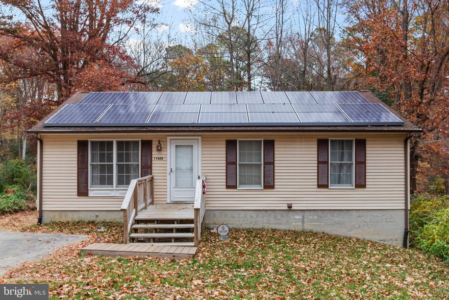 Welcome to 11660 Big Sandy Run, a 4-bedroom, 3-bath home in the Chesapeake Ranch Estates. This home offers three bedrooms and two full bathrooms upstairs, plus a fourth bedroom, a bonus room, and a full bathroom on the lower level! 

The finished basement is an entertainer’s dream, complete with a custom-built bar and plenty of space to relax or host gatherings. Step outside to a large back deck overlooking an open backyard, ideal for outdoor living. A 10x12 storage shed offers additional space for tools, equipment, or seasonal items.

Major updates include a brand-new septic system and drain fields, giving buyers peace of mind. The home also features solar panels, helping keep monthly electric bills low.

Residents of Chesapeake Ranch Estates enjoy access to three private community beaches—two on the Chesapeake Bay and one on the lake—along with a playground and clubhouse. Located close to Lusby amenities, Solomons Island, restaurants, shopping, and commuter routes, this home offers comfort, value, and convenience.