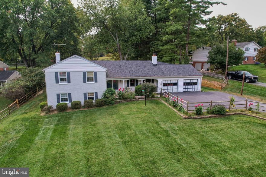 HUGE PRICE ADJUSTMENT! Lovely and spacious six-bedroom home in the highly desirable Ancient Oak subdivision! Tree-lined streets and large yards make the neighborhood a true oasis. A four-level split level with a lovely, landscaped yard, the home has views of tranquility from every window. Main level has an updated kitchen with generous table space in front of a fireplace, living room, and dining room opening into a Florida room. Upper level boasts a roomy primary bedroom with bath and walk-in closet, three other bedrooms, and the upper level full bath. Third level features a charming family room with fireplace, two more bedrooms, a full bath, and sizable laundry room complete with extra storage and natural light. Sixth bedroom is currently used as an office, but has egress and closet. Lowest level has huge unfinished space that offers all kinds of possibilities! Home has heavy-up 1000-amp electrical panel, a multi-feature water treatment system (with UV light, softener, and neutralizer), sump pump with battery backup (has not been needed), an 80-gallon hot water heater, three attic storage areas, a whole-house attic fan and two fireplaces. Garage is a car enthusiast's dream -- with four spaces as well as tool/storage areas. Upgrades include a Certainteed 50-year roof (2020) and new A/C (2025). Gorgeous outside space has raised flowerbeds with meticulously maintained plants and a large patio in a private fenced backyard. No HOA - and yes, there is a working hand pump to the well! This home has it all, and is just close enough to areas for sports, shopping, and dining while maintaining its quiet and charming community feel. Come check it out!