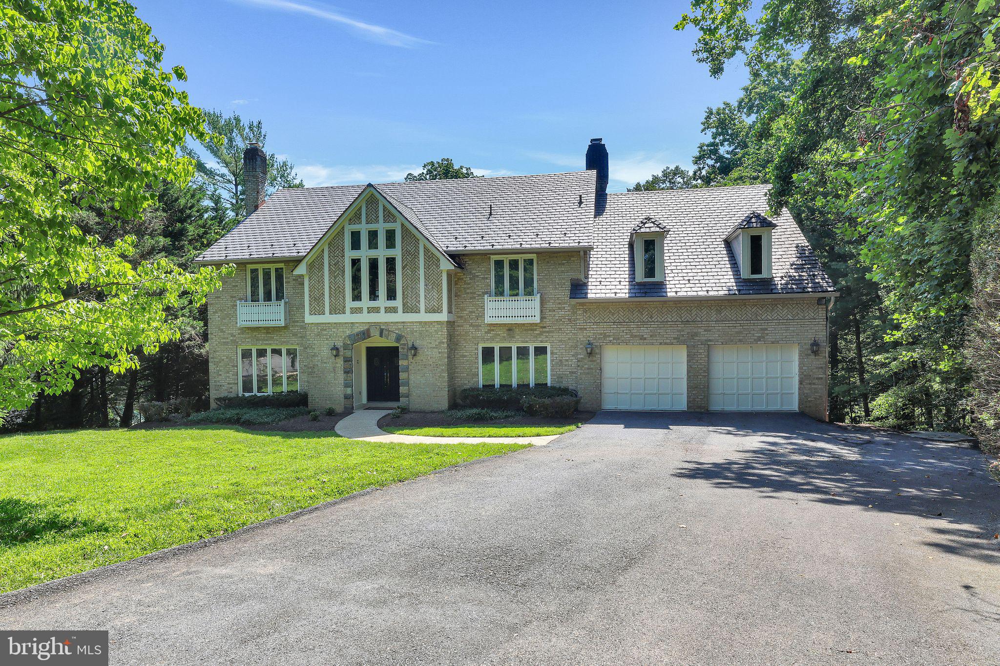 Experience the best of Potomac living in this beautiful, sunlit Tudor-style home, ideally located on a lush, private two-acre lot a stones throw to Potomac Village. Nestled on a quiet cul-de-sac, this spacious residence features six bedrooms, four full baths, and two half baths, offering plenty of space for family and guests. The inviting main level includes formal living and dining rooms, a large family room with a stone fireplace and wet bar, eat-in kitchen, a private office, and a charming solarium and screen porch—ideal for relaxing and enjoying the natural surroundings.
The primary suite is a true retreat, complete with its own fireplace, a luxurious bath and ample closet space. Upstairs, a large finished fourth level with a half bath offers flexible space for a studio, play room, teen hang out or additional bedroom. The fully finished, walk-out lower level features a recreation room, bar, wine cellar, second kitchen, bedroom, and bath—perfect for extended family, guests, or entertaining.
Don’t miss this rare opportunity to enjoy comfort, privacy, and convenience in one of Potomac’s most desirable locations.
** All sqft and dimensions are estimated.