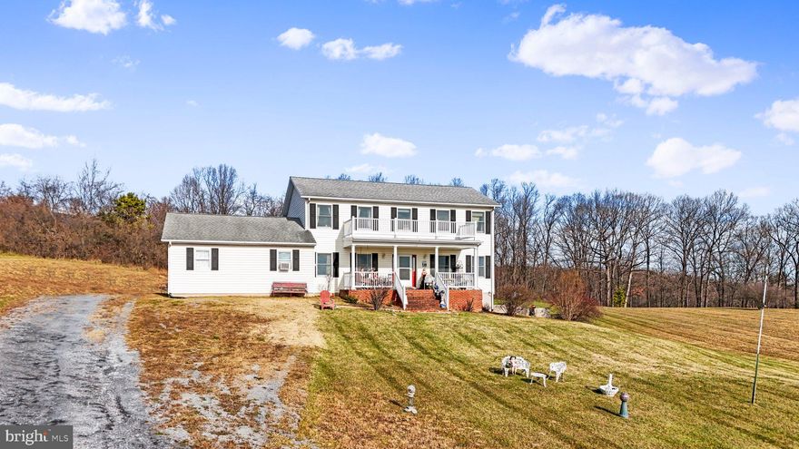 Pictures will be uploaded on 12/09/23. Subject to sellers finding home of their choice. Relax and watch the sunset and the sunrise on your front porch. Lovely colonial home set on a serene 6 acres in Hedgesville, WV. 4 bedrooms upstairs, with a primary bath and 2nd full bathroom. Laundry located on upper level as well for ease. Downstairs there is a family room, living room, dining room, and the kitchen. There is also a half bath and large pantry. The garage was turned into a fifth bedroom but could easily be converted back into a 2-car garage. Full unfinished basement to use for storage or finish it for extra living space. At the back of the property down the hill is a small stream. Selling AS-IS.