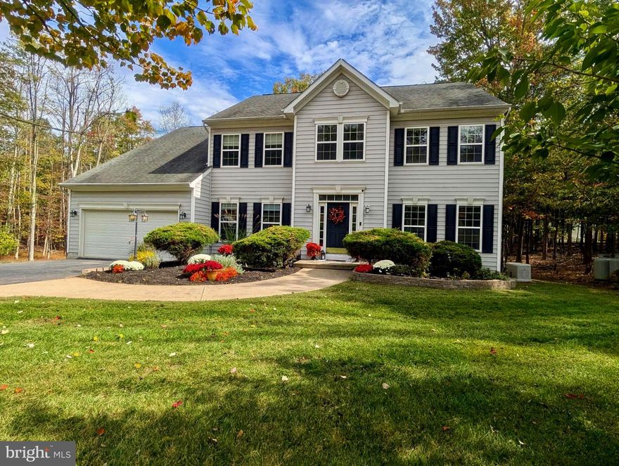 Price improvement!  Seller may consider negotiating a 2-1 Buy Down to help lower the buyer's interest rate with strong offer.  If you saw this one before, you should take another look!  With newly refreshed front landscaping this beautifully updated 5,160 sq ft Sequoia model on 2.2 private, wooded acres is ready to welcome its next owners. Featuring three fully finished levels, this 4 Bedroom / 4.5 Bath home offers the perfect blend of comfort, style, and space.  The main level showcases formal living and dining rooms, a dedicated home office, a cozy family room with a gas fireplace, a spacious kitchen, and a light-filled sunroom. Fresh paint touch-ups and subtle interior updates bring a bright, inviting feel throughout.  Upstairs, the luxurious primary suite includes a sitting area, gas fireplace, walk-in closet, and spa-like bath. A second bedroom suite and Jack-and-Jill bedrooms provide ideal flexibility for family and guests.  The fully finished basement with full bath offers two large spaces for endless possibilities - rec room, gym, office, or even a potential fifth bedroom - plus abundant storage, a second sunroom, and walk-out access.  Outside, enjoy your own above-ground pool and peaceful wooded setting, just minutes from The Woods Golf Course and Sleepy Creek Wildlife Management Area. A whole-house generator with gas tanks will also convey.  This home truly has everything you could need - space, style, and serenity - all at a refreshed new price. Come see the difference!