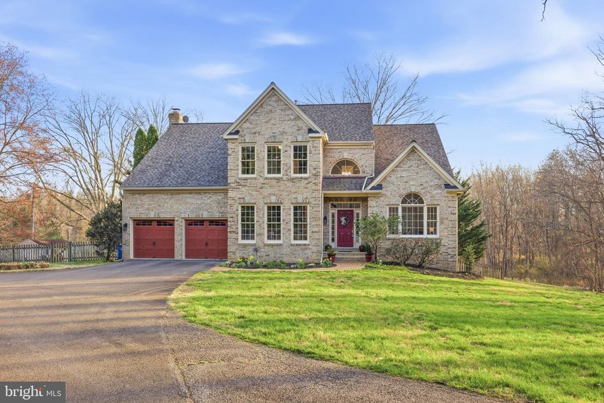 Welcome to 7726 Ox Road in Fairfax Station, a beautifully maintained home set on a private 1.46-acre lot surrounded by mature evergreens and peaceful natural views. This spacious NO-HOA property offers a thoughtful layout with generous living spaces and numerous upgrades throughout. Step into the 2-story foyer and view the gleaming hardwoods and the large windows!  This home is filled with natural light and includes a formal living room with high vaulted ceilings that really create an impressive and open feeling.  A first-floor office also makes this level very convenient.  But the heart of the home is the large, renovated kitchen which features a Viking cooktop (2022), Thermador refrigerator (2022), Bosch dishwasher (2024), granite countertops and a newly added large island (2022), creating a perfect space for everyday living and entertaining.  A large bright family room completes this area, and the wood-burning fireplace also adds ambiance to this special space.  Enjoy the laundry on this level and access the large composite deck and screened-in porch from the spacious family room too!  This screened-in porch is the perfect place for entertaining or relaxing.  Upstairs you’ll find the 4 bedrooms along with the 3 coveted full bathrooms.  One of the bedrooms enjoys its own ensuite full bathroom.  The spacious master bedroom has a vaulted ceiling, 2 large walk-in closets and a stunning renovated primary bath featuring a lovely large vanity, huge walk-in shower and large soaking tub. The walk-out basement features a large open finished area along with convenient large storage and access to the large brick covered patio too.  This area is ideal for a rec room, media room, or a potential 5th bedroom with a walk-in closet. Major updates include a new roof (2020), water heater (2021), and a brand-new HVAC system installed in 2025 (2nd system is from 2016) offering peace of mind for years to come. Additional highlights  include city water and recently inspected Septic System.  The property extends beyond the fenced yard and offers a rare combination of privacy, mature landscaping, and convenience to parks, commuter routes, Metro, VRE, and the top Fairfax County schools of Sangster Elementary and Lake Braddock Secondary!