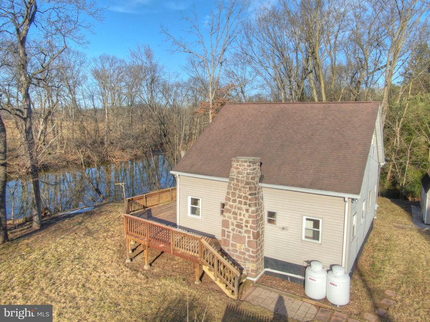 Don't be shy! We are still welcoming showings even thought the listing status is Active Contingent. Schedule today! Experience the peace and serenity of country living in this stunning Spring Grove Schools home. Nestled on a private creek front property along the tranquil Conowago Creek, this property boasts breathtaking views and a serene setting. The driveway provides easy access and ample parking for you and your guests.
Step inside to find a home that has been recently updated with fresh paint, a sleek new bathroom,  and plush new carpet. Enjoy the convenience of propane forced heat and central AC to keep you comfortable year-round. The spacious basement features an egress to the yard, providing additional living space and storage options. The large wrap-around deck is perfect for entertaining guests or relaxing with a good book. The shed provides additional storage and the perfect place to keep your gardening tools and equipment. The primary bedroom features vaulted ceilings, a private bathroom, and 2 spacious closets. The gourmet kitchen is a chef's dream, with stainless steel appliances and ample counter and cabinet space. Don't miss out on the chance to make this tranquil creek-front property your own. Schedule a tour today!