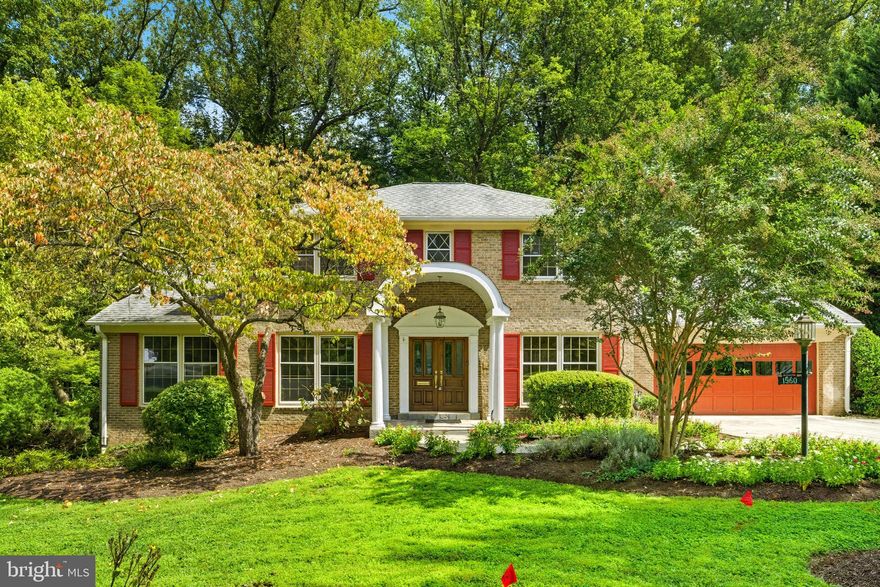 Open house this Saturday 1-3pm!  All-Brick Colonial Backing to Parkland in Exclusive McLean!  Set on a tranquil, tree-lined street in one of McLean’s most visually beautiful neighborhoods, this stately all-brick center-hall colonial offers timeless elegance and modern comfort. The property enjoys a premier lot backing to lush parkland with direct access to trails leading to the community pool and tennis club.  Inside, the home blends classic architecture with thoughtful updates. The Living Room features beautifully finished oak floors, and the expanded and remodeled kitchen is a chef’s dream, featuring a 48-inch Viking range with griddle and hood, paneled Sub-Zero refrigerator, oversized island with prep sink, abundant cabinetry, and extensive counter space. The sunlit breakfast room with bay window and gas fireplace creates a warm gathering space overlooking the trees and parkland. The inviting family room boasts refinished pegged hardwood floors, a second gas fireplace, and French doors opening to the patio. Upstairs, refinished hardwood floors flow throughout four bedrooms, including a spacious primary suite with new premium carpeting, two oversized walk-in closets, and a European themed bath. The finished walk-out lower level boasts an enormous Recreation Room, Home Office, and a fifth bedroom, full bath, cedar closet, and Storage Room. Additional highlights include a main-level laundry/mudroom with cabinetry and generous storage, two-car garage with Garage-Tek style organization system and epoxy floors. The large, screened porch with stone floor offers sweeping park views. Explore the beautiful trail system in the adjoining woods and enjoy a short walk to the popular Lewinsville Park. The neighborhood features large, beautiful lots, flowering trees, sidewalks, underground power lines for natural beauty and easy access to Washington DC and Tysons Corner. This rare combination of privacy, convenience, and community amenities makes this home a true McLean treasure.