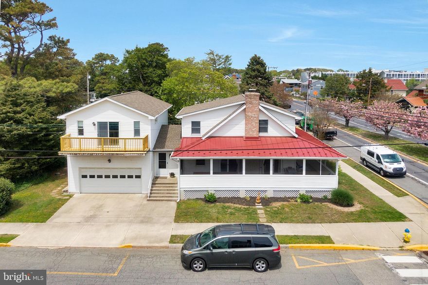 This Quintessential Rehoboth Beach Home has been family owned since 1963, served as their primary residence since the 70’s,  had a major renovation in 1992 and never rented.   Meticulously maintained, this cherished family home is sited on a corner lot, just 2 Blocks from the Beach, and offers 4 Bedrooms, 2.5 Baths, Hardwood Floors, a Wood Burning Fireplace with brick surround, Outdoor Shower, an expansive Private Bedroom and Bath over the Garage with a balcony, a Classic Wrap-Around Screened Porch, and a Very Rare TWO Car Side-Load Garage.  The family room and dining area each offer French doors to that fabulous Wrap-around Screened Porch.  Down the hall from the kitchen is where you’ll find a 2nd entrance to the home with a large foyer/mudroom with laundry, access to the garage, as well as access to the bedroom above the garage.  The home also offers 3 zone central heat and air all under a service contract.  This ideal location within the highly coveted City of Rehoboth Beach allows for easy walking proximity to a myriad of shopping, dining and cultural offerings, as well as the mile long boardwalk and Atlantic Ocean beach.