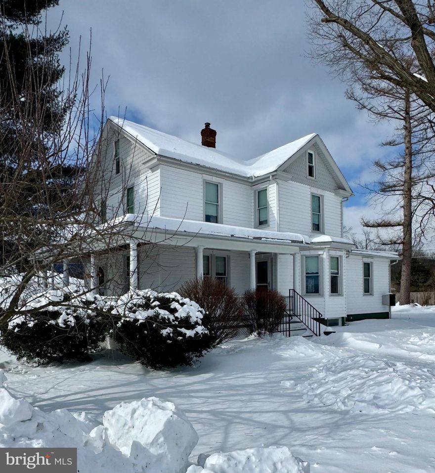 A large wraparound porch welcomes you to this immaculate, move-in ready home featuring 3 bedrooms and 2 bathrooms. Centrally located in Alexandria, it offers an easy commute to Altoona, State College, and Huntingdon. Pride of ownership is reflected both inside and out.  Enjoy the extra outdoor space on a beautiful double corner lot situated on a quiet street. The property includes a one-car garage and a large shed—perfect for a workshop or additional storage. Imagine adding a swimming pool on the extra lot and voila, you already have the pool house. The possibilities are endless. Inside, modern updates blend seamlessly with the charm and character of an older home. The addition features a spacious family room with expansive outdoor views, a pellet stove, and a convenient combination ¾ bath and laundry area. The renovated kitchen offers quality cabinetry and a built-in desk workspace, while the formal dining room’s accent window fills the space with natural light. Upstairs, you’ll find three comfortable bedrooms, a spacious hallway walk-in closet,  and an updated full bath, completing this inviting and versatile home.