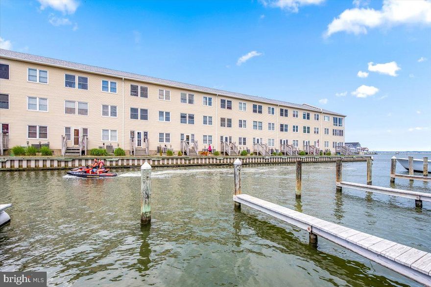 Reduced 11k! This is the one you have been waiting for! Top floor, Bayfront 2 Bedroom/2Bath with assigned boat slip. Great mid-town location close to the beach and many of your favorite OC restaurants and retail spots. Fabulous open floor plan and an enclosed porch that extends the living space and offers open water views. There are two assigned parking spaces and property is sold fully furnished. Sold as-is and priced to sell!