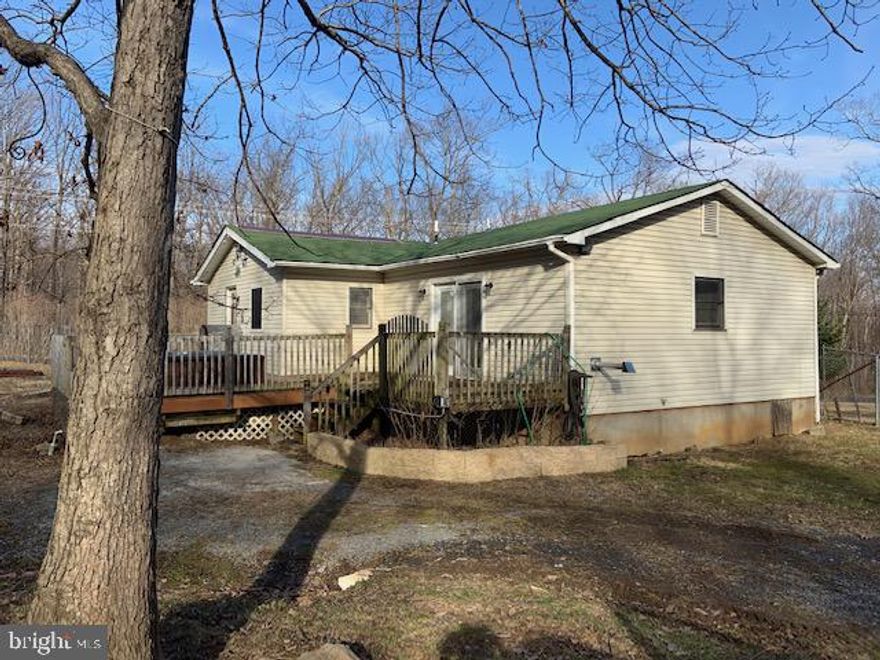 BACK ON THE MARKET!  Spacious, one level cottage on a level lot, minutes to Winchester Medical Center. Waiting for a bargain? Look no further! This home offers 1.38 acres with  2 BR, 1 BA and a spacious family room. There is a separate building that can be used for storage, a home office or the man cave/she shed! The possibilities are endless! The property backs to woods and offers a private peaceful setting.