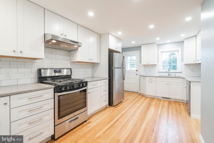 Welcome to 1411 Medford Road, an exceptionally recrafted 2-3 bedroom, 1 and a half bath stone colonial nestled on nearly a quarter acre of flat ground with expansion possibilities in one of Wynnewood's premiere locales.   Countless upgrades can be found throughout this home including a soothing color palette that lends itself to the utmost in relaxation and enjoyment.  The first floor is highlighted by recessed lighting and hardwood flooring throughout and  offers a living room with coat closet  enhanced by deep window sills and generous millwork leading to a formal dining room with a handy built-in wine rack. An updated powder room with new commode, generously sized granite countertop with undermount sink can also be found on this first floor.  An amazing eat-in kitchen with it's recessed lighting and hardwood flooring is perfect for the gourmet chef and offers granite countertops that compliment a white subway tile backsplash and white cabinetry, stainless steel appliances and eating area with overhead pendant lighting.  The kitchen also has a workstation that features granite countertops, overhead white cabinetry,  stainless steel undermount sink with handsome gooseneck spigot and stainless steel dishwasher.  From the kitchen there is access to  a covered flagstone porch that leads to a flagstone patio  overlooking the spacious and flat rear yard - this outdoor space is the  perfect backdrop for dining al fresco, entertaining friends or simply relaxing!  The second floor boasts gleaming hardwood floors and houses the primary bedroom with cedar closet,  additional closet and tasteful  wall lighting sconces, a completely updated hall bath with tub/shower, new commode and new undermount sink with granite countertops with storage below.  A second bedroom with built-in bookcase and closet lead to an attached third bedroom, which could also serve as a study or in-home office.  The  possibilities are endless in the unfinished lower level, which offers 600 square feet that currently houses a built-in workbench, laundry facilities with front loading washer and dryer and new laundry tub.  This home also offers an attached garage, central air, gas heat, new windows and plumbing and electrical upgrades.   1411 Medford Road is less than a twenty minute drive into Center City Philadelphia, a five minute drive to Lankenau Medical Center and is located within the catchment of  the award winning Lower Merion School System and is within proximity to Giant Super Market, Whole Foods, Suburban Square, numerous modes of public transit including Septas  Paoli-Thorndale Regional Rail Line,  houses of worship, public parks and more