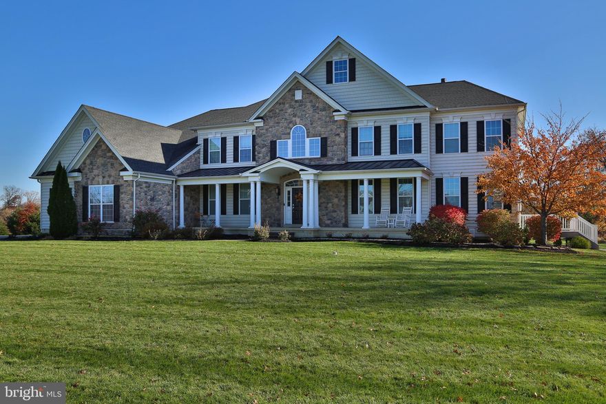 WOW!! Gorgeous home now available in highly desirable Plumstead Preserve!  This 6 bedroom, 5.5 bathroom home features hardwood floors, upgraded trim work, and functional upgrades throughout on an ideal lot surrounded by preserved open space, 3 laundry rooms/one on every level, 3 car side entry garage, and a full two-story in-law suite with separate entrance! As you enter the foyer, you will see a breathtaking grand curved staircase that will knock your socks off! The dining room/living room includes crown molding, oversized baseboards, and shadowbox wainscoting w/ chair rail.  The stunning gourmet kitchen is located off the dining/living room and features a wealth of cabinets for storage, granite countertops, tiled backsplash, an oversized island with seating, triple window w/ transom over the double bowl stainless steel sink, built-in dishwasher, electric Kitchen Aid cooktop, built-in oven microwave combo, a desk with additional cabinetry and a large breakfast area that has access to the deck, pavilion, and backyard.  The beautiful family room is fantastic for entertaining and includes 10 ft ceilings, gas fireplace with stone surround, decorative wood paneling, ceiling fan, and 4 large windows with transoms that allow plenty of sunlight. A nice sized office and powder room are located next to the family room. The living room/pool table room is spacious and includes a gas fireplace, two-piece crown molding, shadow box wainscoting w/ chair rail, double windows, and a secret door that has access to the in-law suite.  The In-Law suite features an open floor plan with a living room that includes a gas fireplace w/ stone surround and a full kitchen.  There is access to a private deck with a view of the woods and has a private walkway outside from the front of the house.  The In-law suite bedroom, full bathroom, laundry room with walk-in closet, and a 2nd additional room is downstairs with a separate HVAC system.  The mudroom and first floor laundry room are conveniently located off the garage entry and completes the first floor. There are 3 staircases to the second floor which features a huge bonus room for additional entertaining/tv/play area. The primary bedroom has a double door entry into a sitting room, large bedroom area with wood paneling on accent wall w/ sidelights, walk-in closet, tray ceiling, and crown molding.  The primary bathroom features an upstairs laundry room, a large soaking tub, walk-in shower with tile surround and seating, dual vanities w/ single bowl sinks and cabinetry, and a huge 2nd walk-in closet!!! The 2nd and 3rd bedrooms are located in the front of the home, and each include a private bathroom with a tub/shower combination and single bowl sinks with vanities. The 4th and 5th bedroom are nicely sized and share a bathroom. The home is located on a primary homesite in the neighborhood and backs to open space and woods.  The enormous deck with Pavilion is a great place to enjoy summer nights to entertain and is wired for TV and outdoor speakers. Additional upgrades include: landscape lighting in the front of the home, two 50-gallon water heaters (one installed 2021), entire-house water softener and humidifier, 20kw entire house generator and auto transfer switch, 3 HVAC units total in house, new AC in 2nd floor, 2 sump pumps, 4 Nest thermostats & 2 Nest Smart Smoke Detectors, and a fun custom made child playhouse in the basement! Home is in the award-winning Central Bucks School District (CB East, Tohickon, and Groveland) and conveniently located close to restaurants and major routes.  Do not miss out on viewing this home – it will not last long!