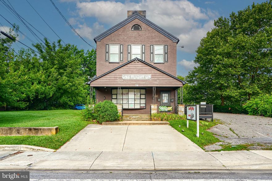 Reisterstown’s Main Street—a designated National Register Historic District (#BA-1273) —continues to thrive as a vibrant commercial hub for both local residents and visitors. This charming corridor is home to unique shops featuring funky refurbished furniture, collectibles, and one-of-a-kind finds. The area also hosts beloved community events such as Music on Main Street, Bloomin’ ArtFest, and the annual Beer and Wine Festival, making it a year-round destination.

56 Main Street is a standalone, two-unit commercial property located at the highly visible corner of Main Street and Village Center Road. This prime location has excellent traffic exposure and off-street parking, enhancing accessibility for customers and tenants alike.

The main level features a stone porch entry and is currently home to the popular retail shop One Flight Up, a local staple operating successfully from this location for the past seven years. The upper level, accessible via a private entrance, is also being used as commercial space, offering additional income potential or flexible usage options.

Whether you're an investor, small business owner, or someone looking for a unique live-work opportunity, 56 Main Street offers a rare chance to own a well-positioned property in the heart of historic Reisterstown.

The building is separately metered with two electric meters, and its location within the Historic District (Reg # BA-1273) provides flexibility for a variety of permitted uses under local zoning guidelines.
This sale is of tax ID# 04040403023326 & # 04040403023327. 
Cuurent tenant on main floor is owner occupant and will convey vacant. 2nd floor tenant would like to stay. 
**Showings are booked directly with listing agent NOT SHOWINGTIME. DO NOT discuss the sale with staff.
**If you are interested in the purchase of the business, plz have your agent contact Suzie Coronel (listing agent) directly.