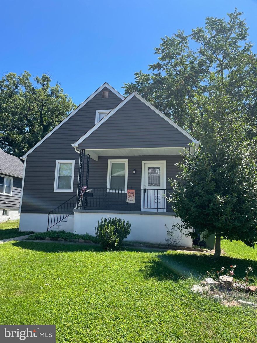 Welcome home to this beautifully renovated home in a quiet community. This 5-bedroom, 4-bathroom, Cape Cod blends modern convenience with timeless charm—an ideal single family home with space for multigenerational living. Outisde, you will notice, an inviting covered front porch and good curb appear, plus off street parking for two cars. When you step inside, prepare to be amazed by the open-concept layout features luxury vinyl plank flooring, recessed lighting, and seamless flow from living room to dining area—the perfect entertaining floorplan. The gourmet kitchen is a stunning: a generous island with breakfast bar, refined quartz countertops, 42 inch white cabinetry, and stainless steel appliances. The main level includes a primary bedroom with ensuite bath, complete with plush carpeting and a spa-inspired walk-in shower with built-in bench. A second bedroom and full bath—featuring a tub-shower combo—complete the main floor. Upstairs, discover a bedroom suite with vaulted-ceilings, walk-in closet and private full bathroom—ideal as a primary retreat or private office/bonus room. The finished lower level offers flexible living space -- a perfect family room, home office, or recreation room—plus two additional carpeted bedrooms, another full bath, and a convenient laundry area with utility sink. Outside, the covered rear patio and fenced yard provide perfect settings for barbecues, relaxation, and safe play. On hot days, enjoy the cool breezes flowing from the dynamic central air system. You're just minutes from city parks, local restaurants, shopping, and major commuter routes such as I‑95. This move in ready home will not disappoint.