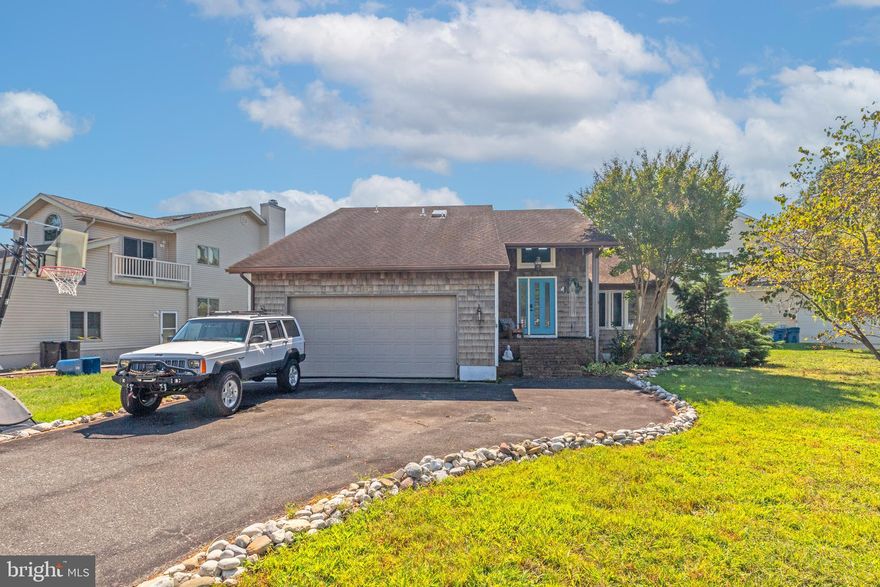 Welcome to this beautiful waterfront home in the desirable Wood Duck II community of Ocean Pines! Featuring 3 BR's and 2.5 BA's, this home has been thoughtfully updated with all new windows and a new front door (2022), plus a completely renovated kitchen (2024). The 1st Fl boasts new LVP flooring, a spacious living room with cathedral ceilings and a cozy gas fireplace, a sunroom filled with natural light, a convenient powder off laundry room, and a first-floor primary suite with an updated bath & direct access to the rear deck. Upstairs, you’ll find two additional BR's, a hall bath with skylight, and a versatile bonus room off bedroom #3 perfect for storage or a home office. There is a pulldown attic stairs with plenty of storage & an access door at the top of the stairs with additional storage space. Exterior highlights include a paved driveway with plenty of off-street parking, a two-car garage with inside access, and a rear deck with a permanent awning accessible from the primary bedroom, sunroom, and kitchen. The waterfront location offers a shared dock with quick access to Manklin Creek and the Cape Isle of Wight Bay. Living in Ocean Pines means enjoying a wealth of amenities, including multiple outdoor and indoor pools, a Robert Trent Jones designed championship golf course, yacht club & marina, restaurants, tennis/pickleball courts, walking trails, parks, playgrounds, and a community center plus easy access to Ocean City. Make this your next home in Ocean Pines!